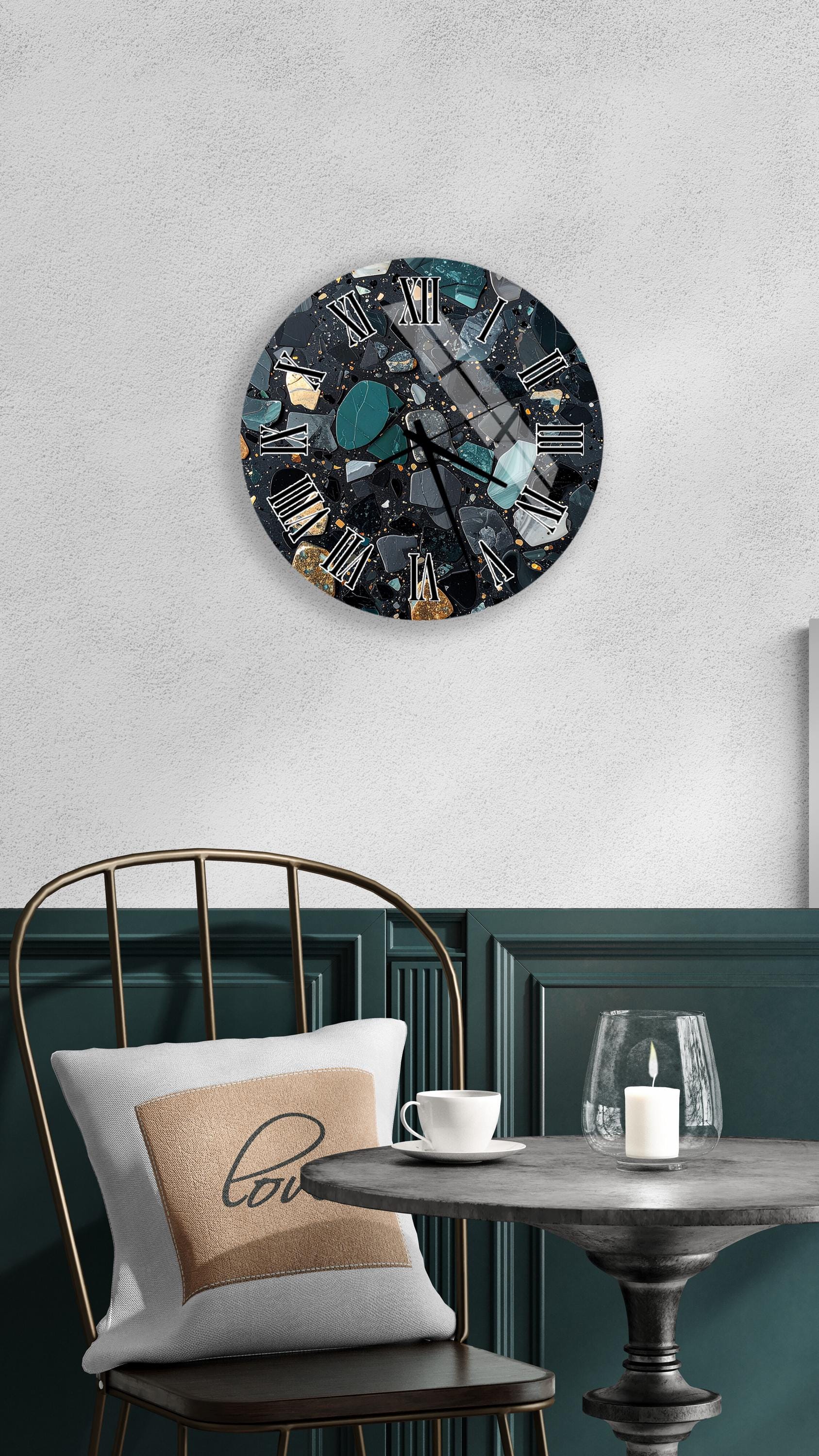 a modern and stylish interior design with a large wall clock, a round table with a white tablecloth, a gold chair, and a glass of water on the table.