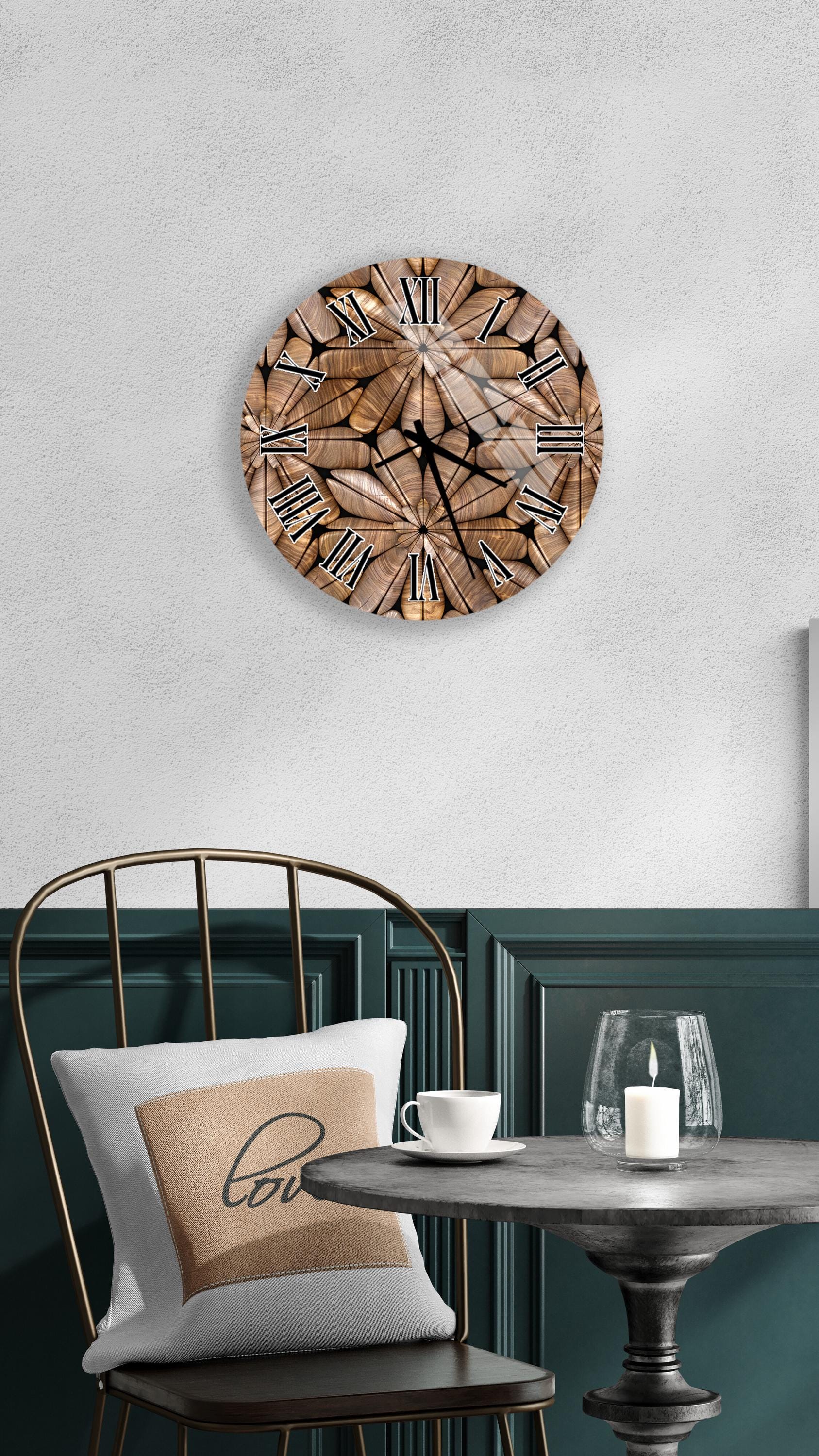 a modern interior design with a wooden clock on the wall, a white table with a candle, and a black chair with a pillow.