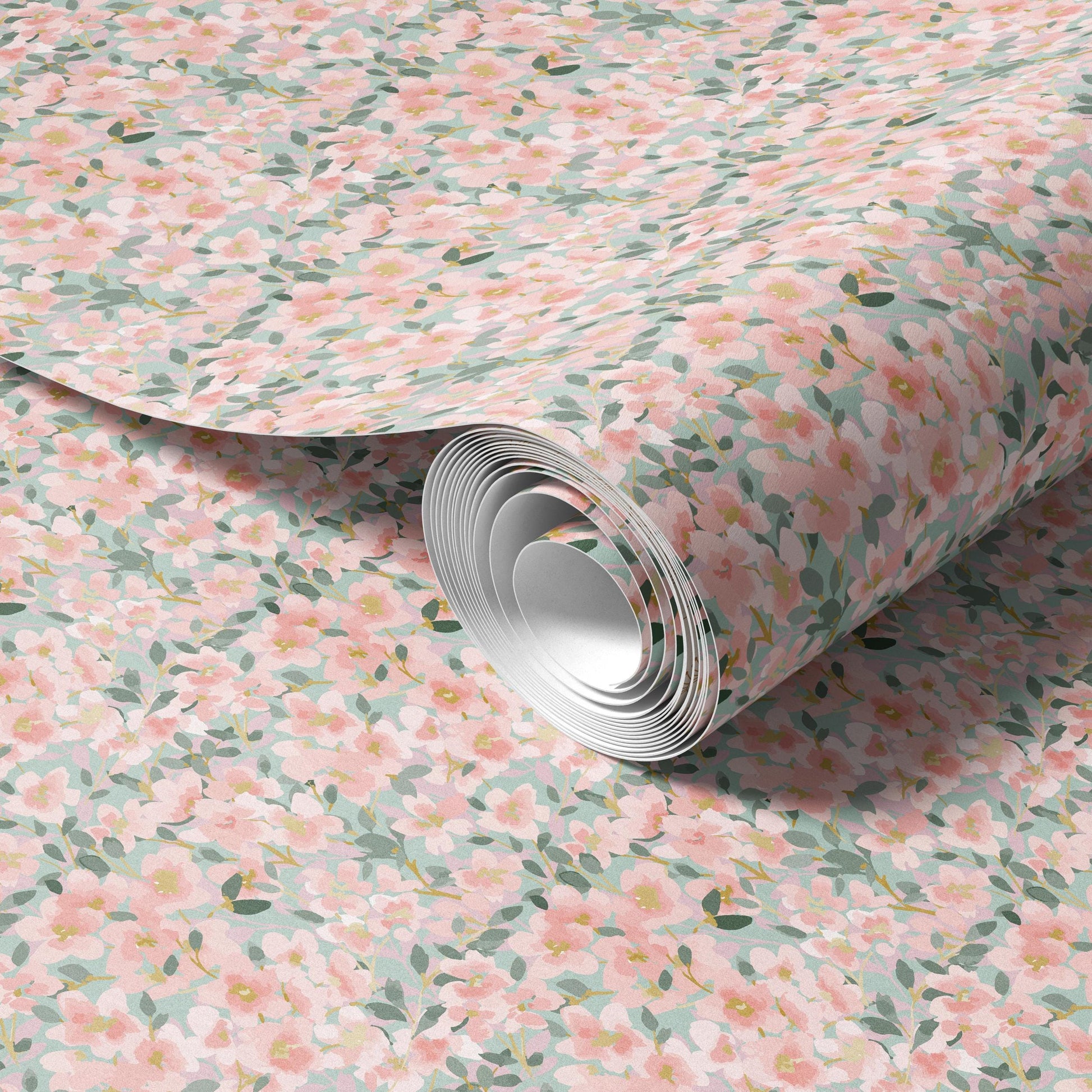a roll of paper with a floral pattern of pink and green flowers on it.