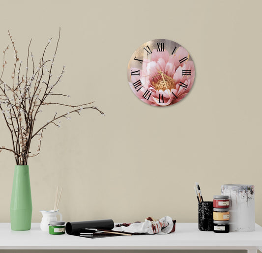 a white table topped with a vase filled with flowers