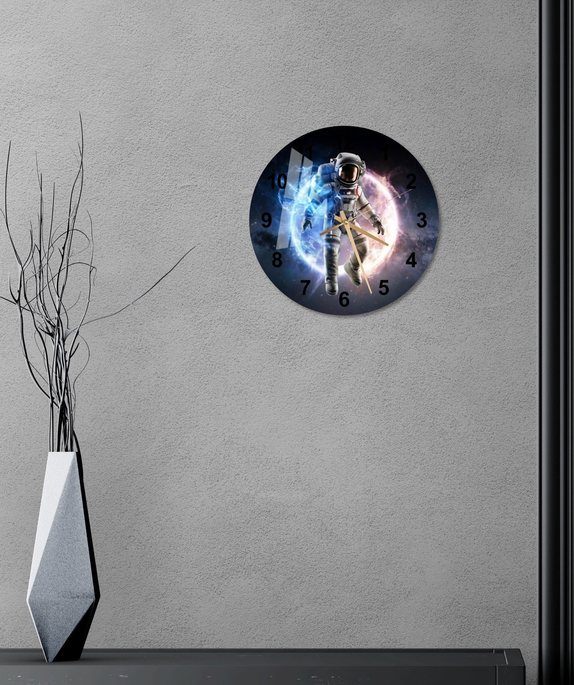 a clock that is on the wall next to a vase