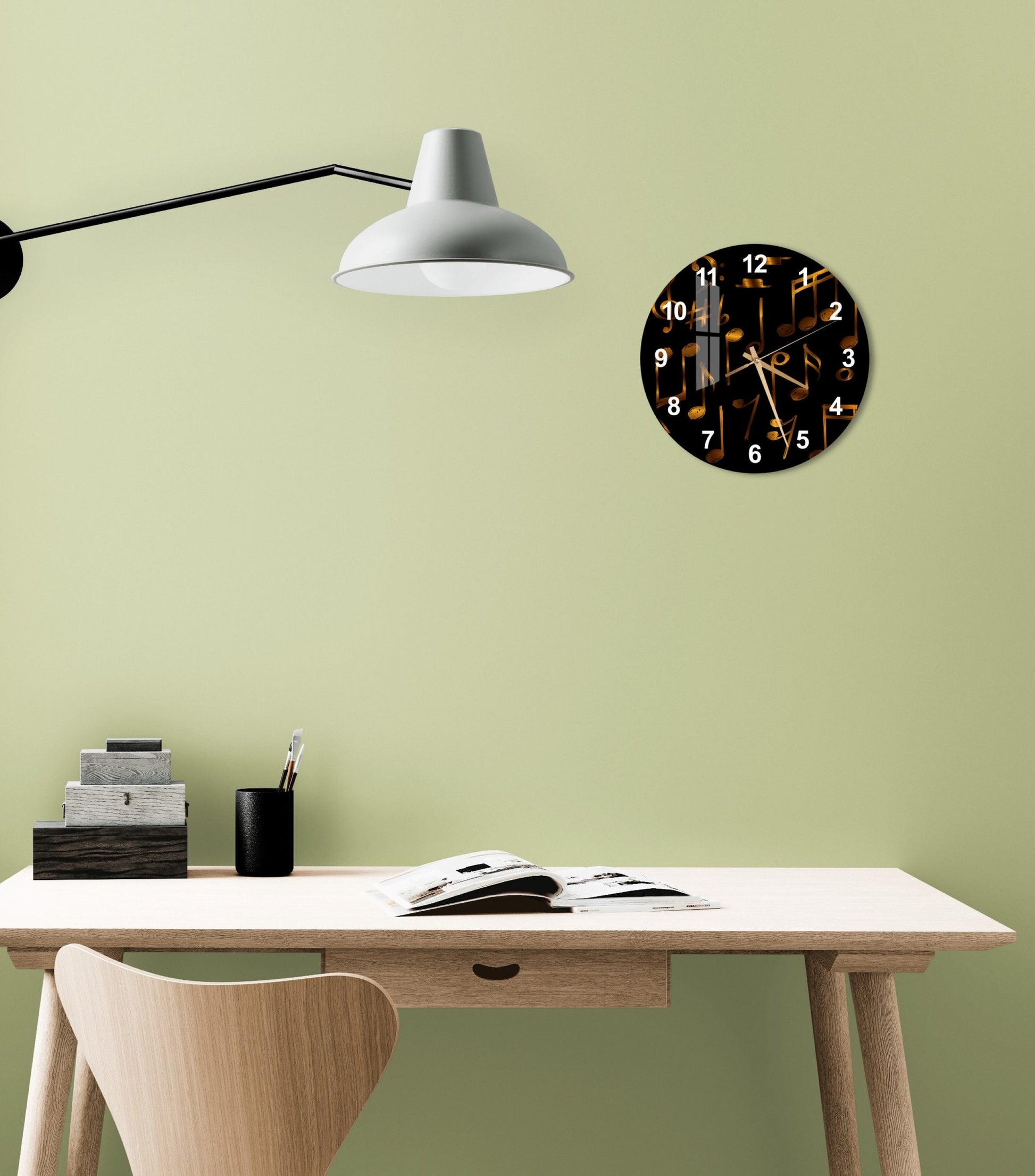 a desk with a lamp and a clock on the wall