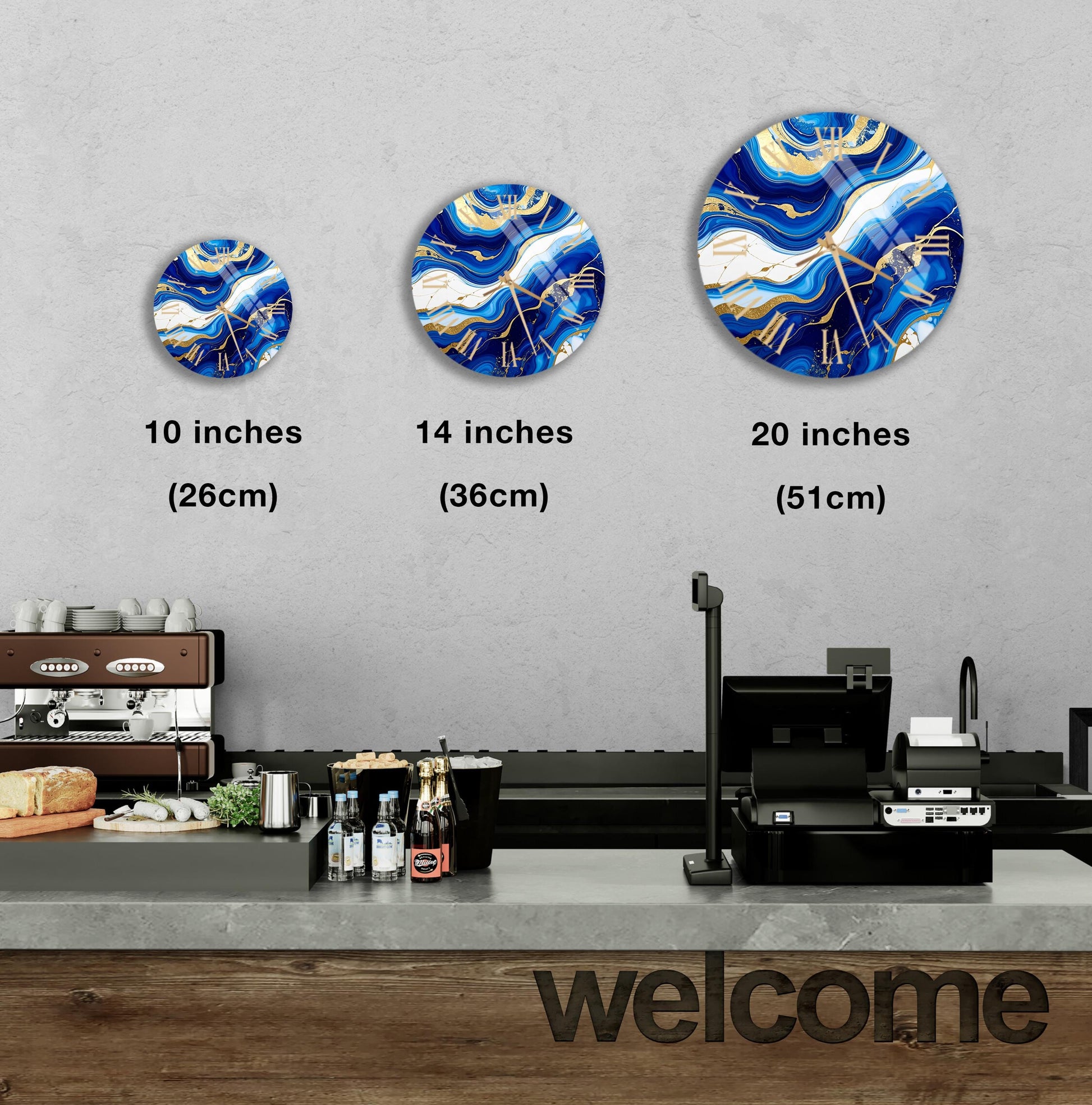 a counter in a restaurant with a "welcome" sign, and three round wall decals of varying sizes above the counter.