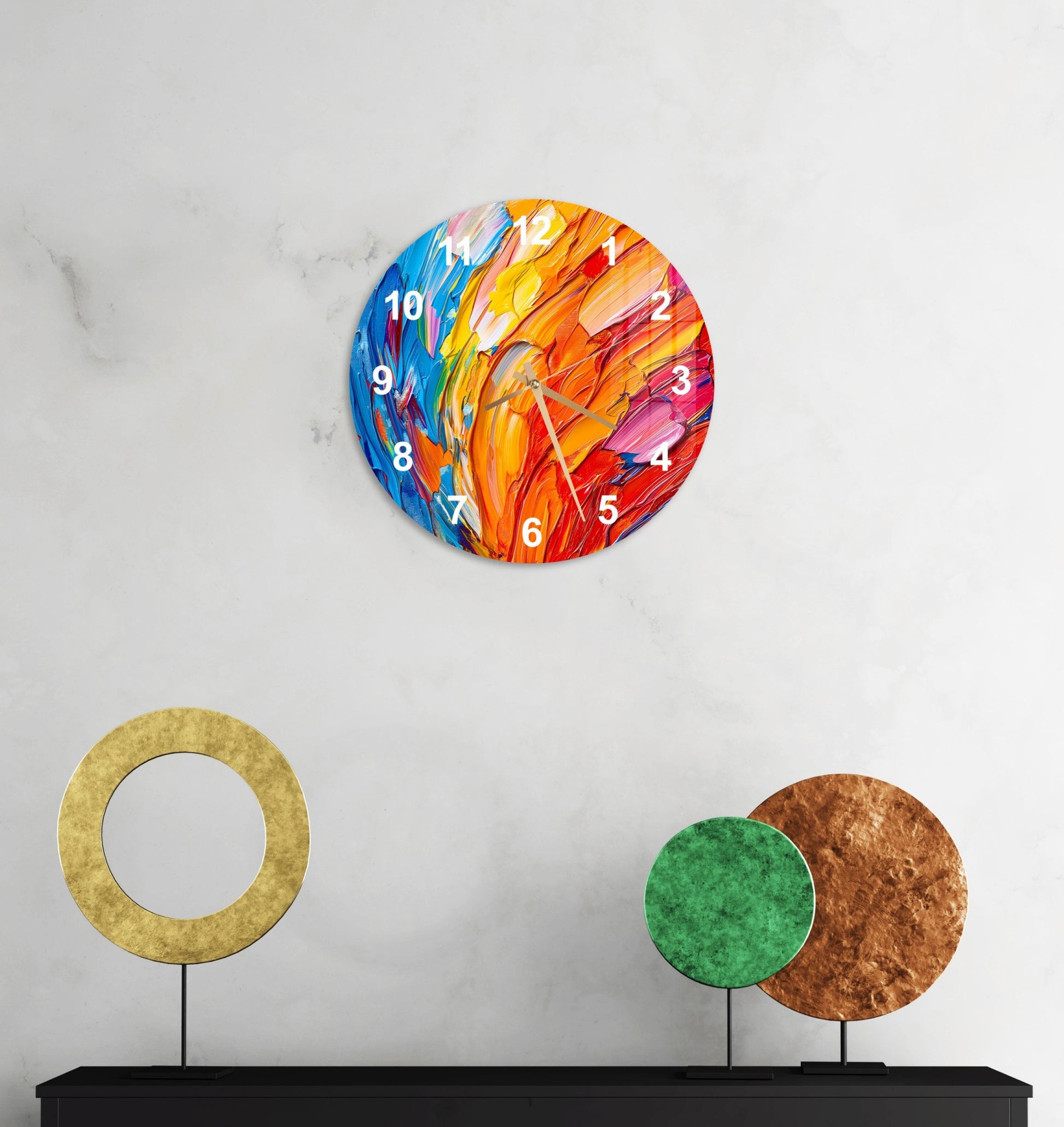 a clock on a wall with a colorful design on it
