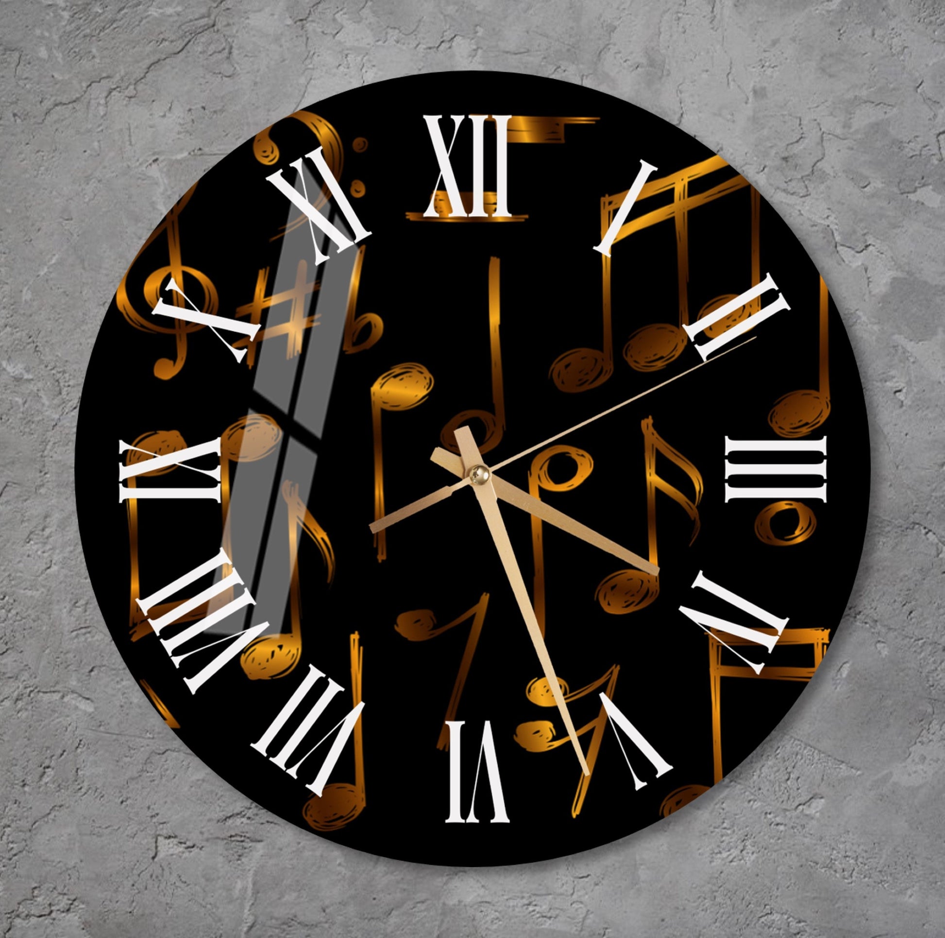 a black and gold clock with musical notes on it