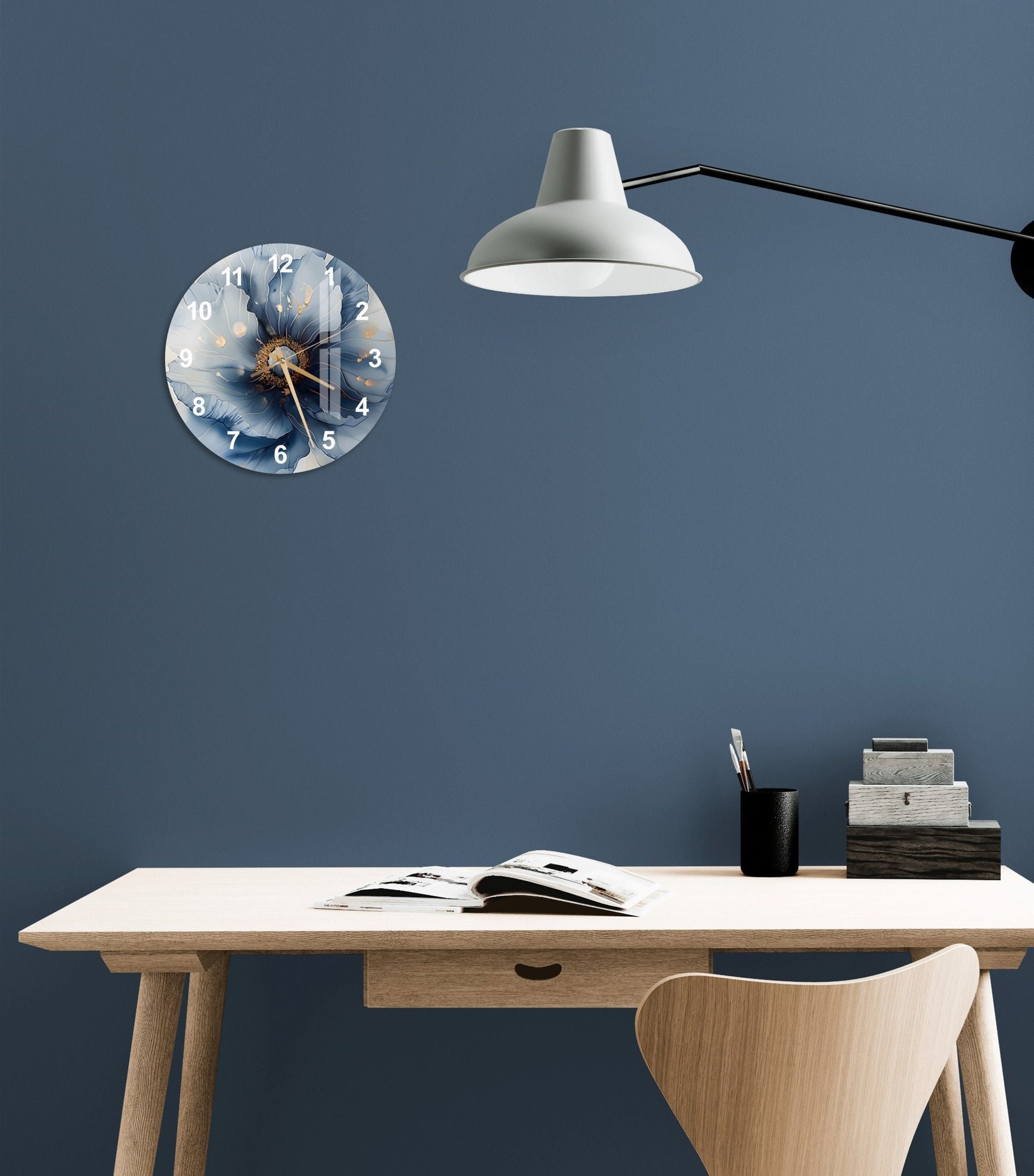 a desk with a lamp and a clock on the wall