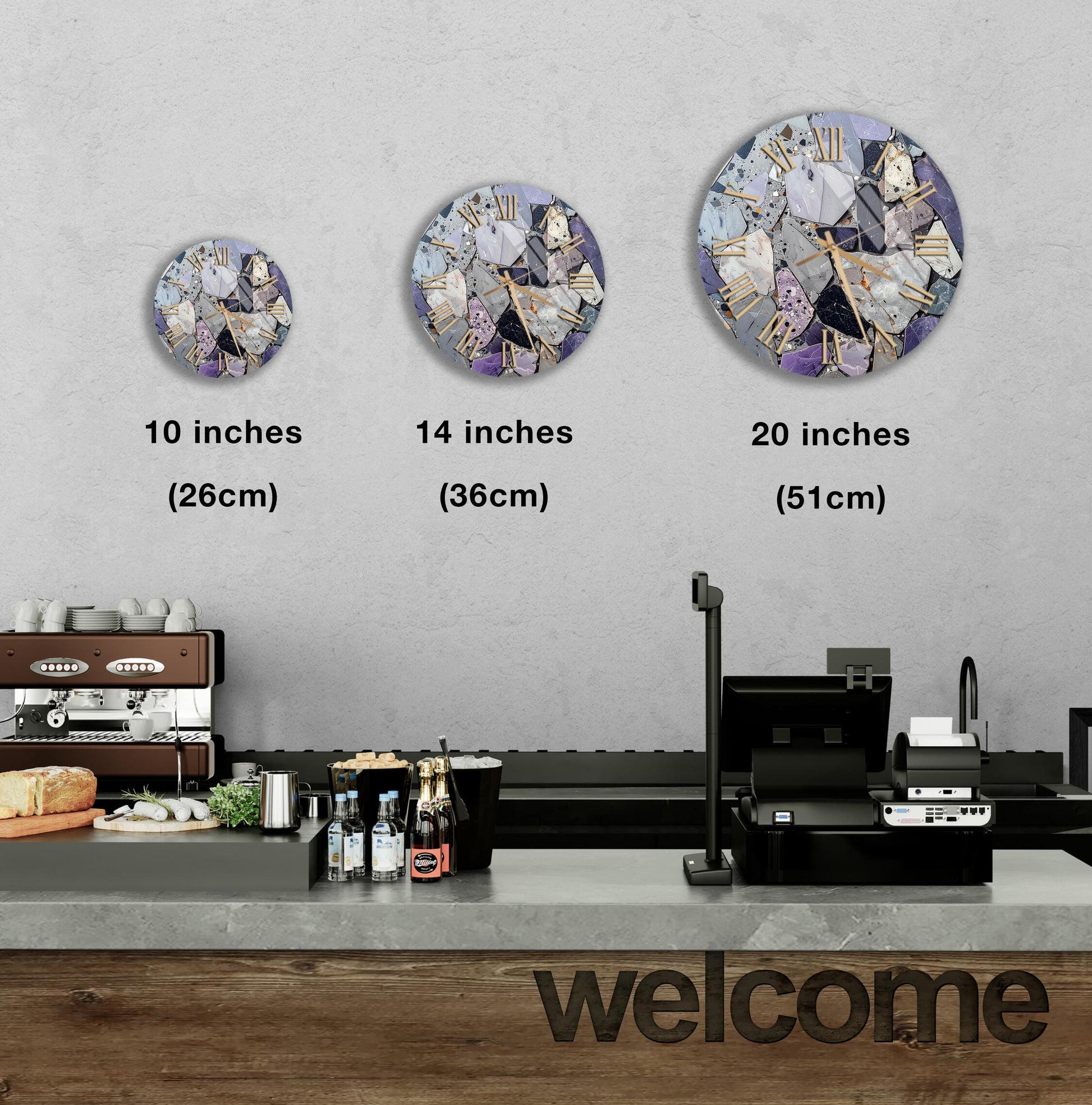 a counter with a cash register, a coffee machine, and various food items such as bottles and bread. Above the counter, there are three clock faces of different sizes, each displaying a different image. The largest clock is located above the counter, while the other two are positioned above the coffee machine. The image also includes text that provides the sizes of the clock faces in inches.