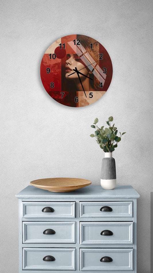 a wall clock with a red and black design, mounted on a wall above a light blue dresser with six drawers. The dresser also has a vase with greenery on it, and there is a wooden bowl on the dresser.