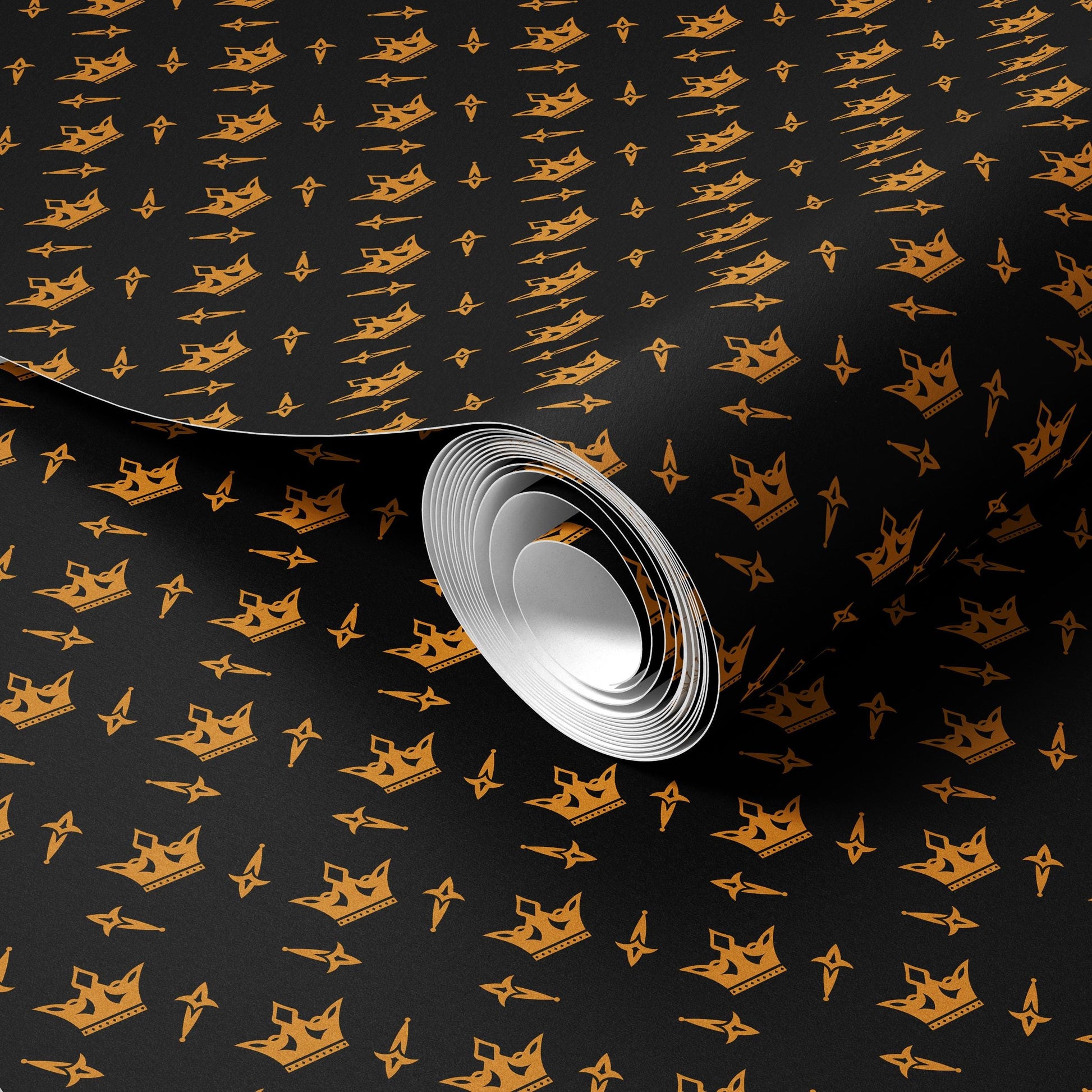 a roll of paper with a repeating pattern of gold crowns on a black background.