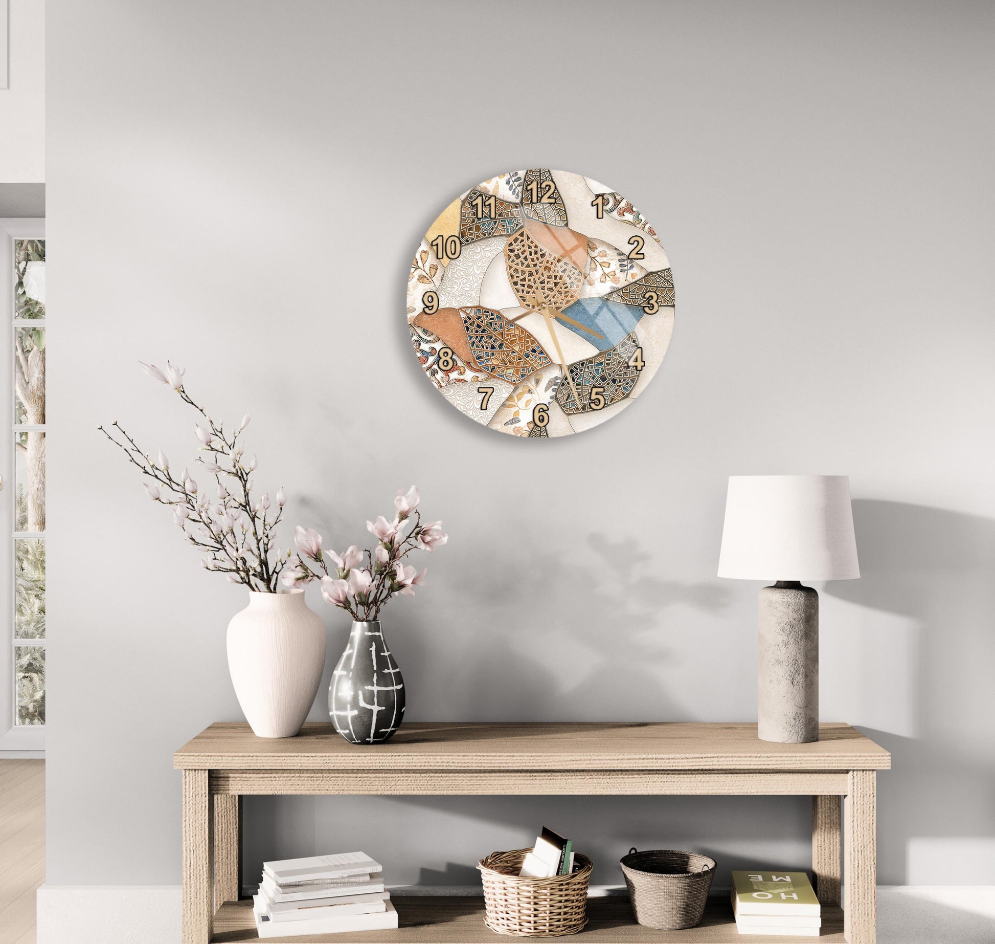 a wooden table with a white vase, a lamp, and a clock on the wall above it. The table also has a stack of books and a basket on it.