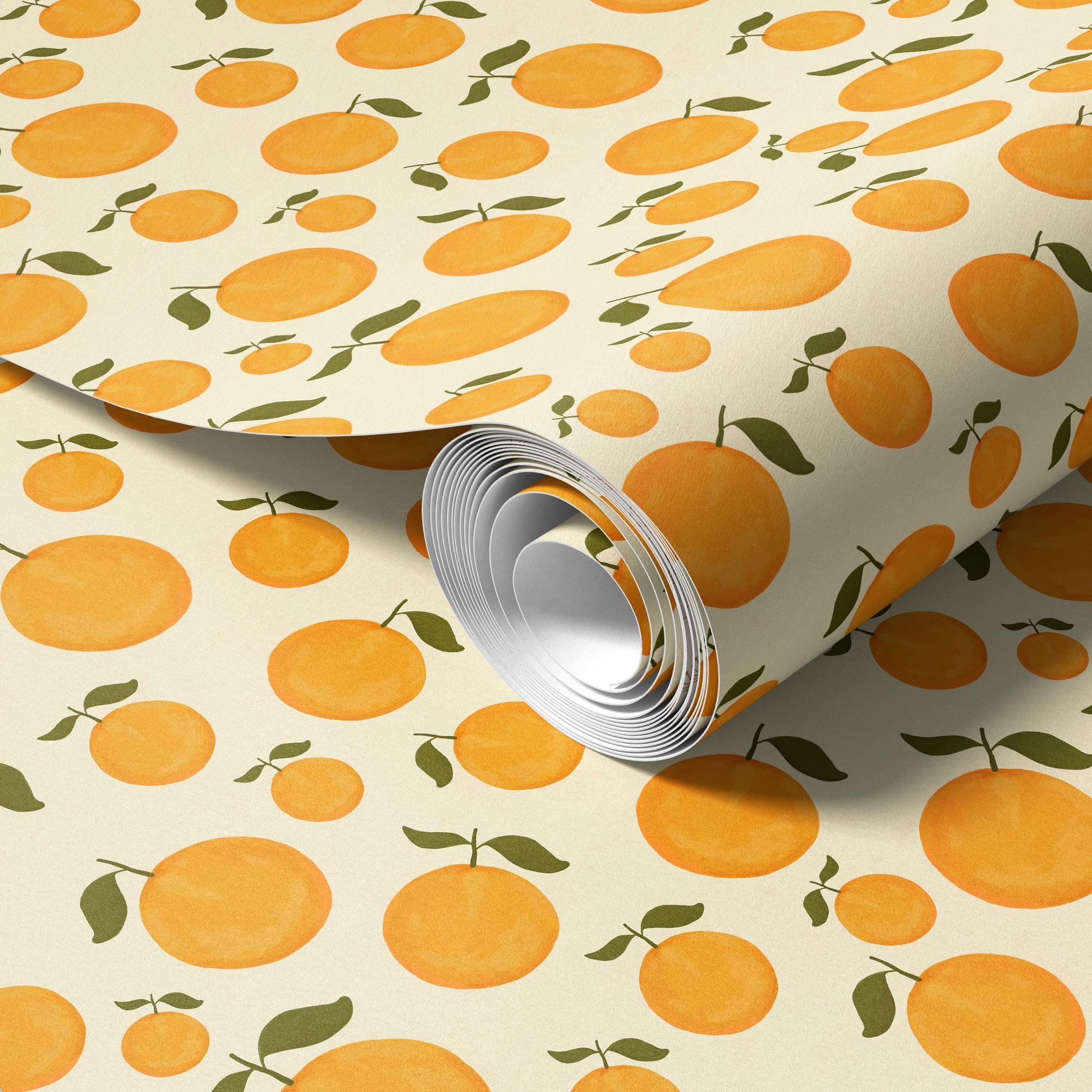a roll of paper with a repeating pattern of orange and green leaves.