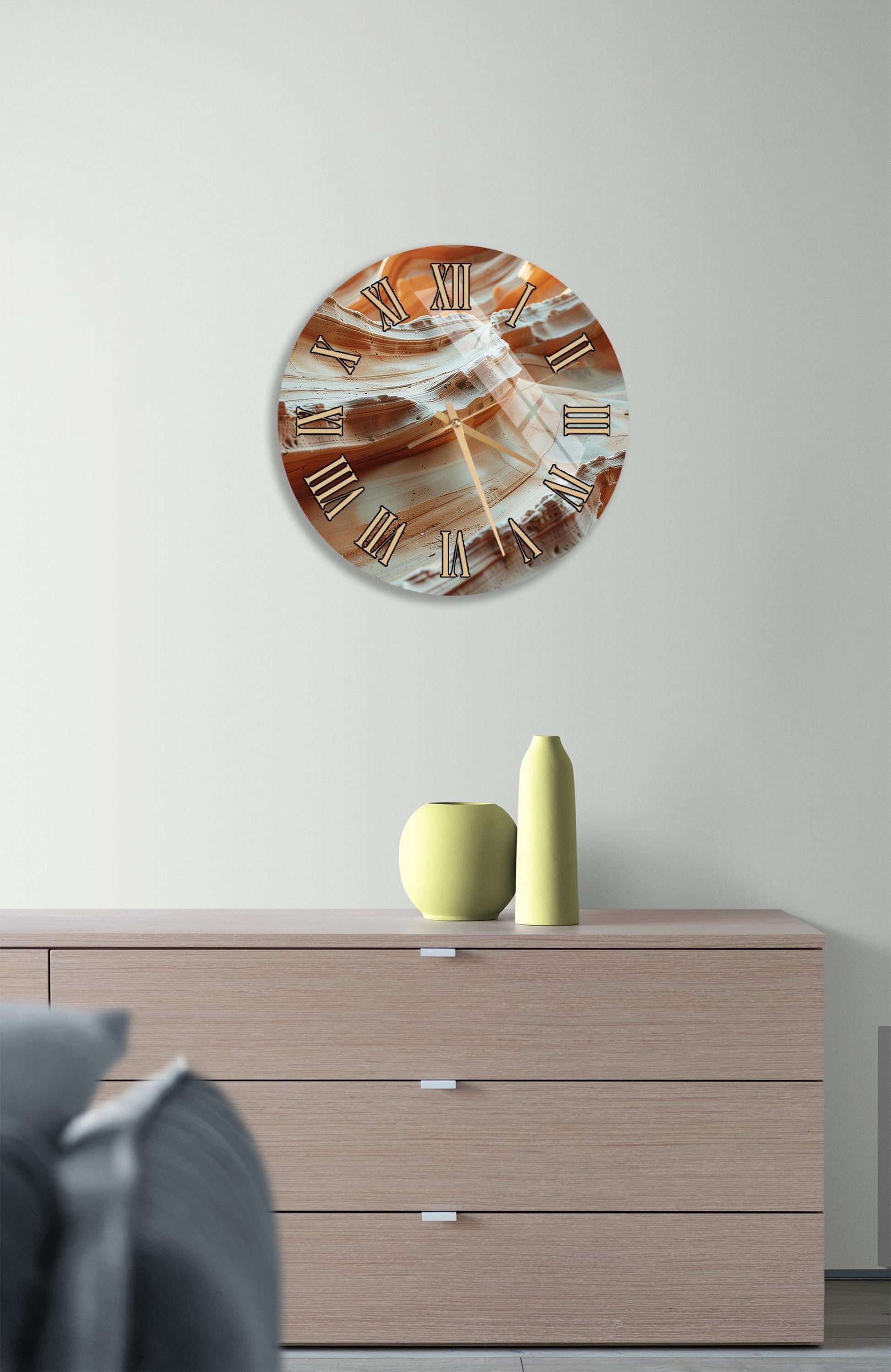 a modern living room with a wooden dresser, a round clock with a unique design, and a small vase on the dresser.
