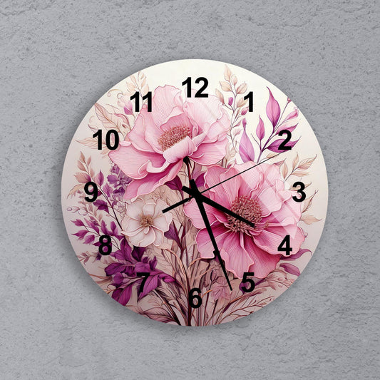 a white clock with pink flowers painted on it