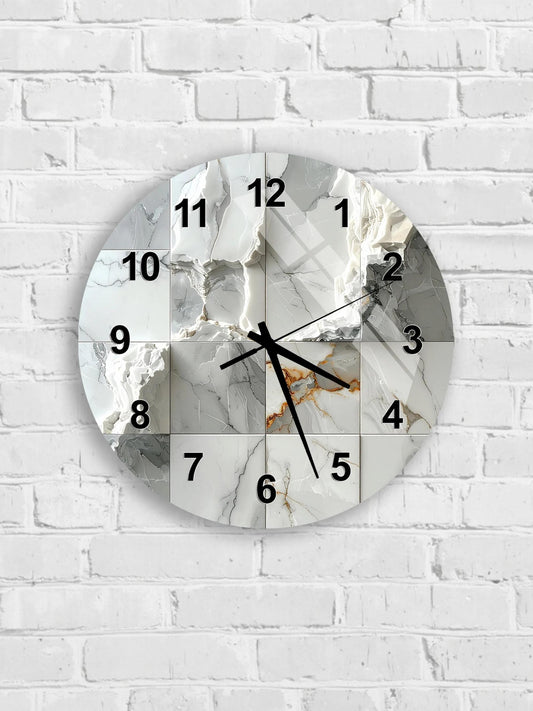 A wall clock with a marble-like design, mounted on a white brick wall.