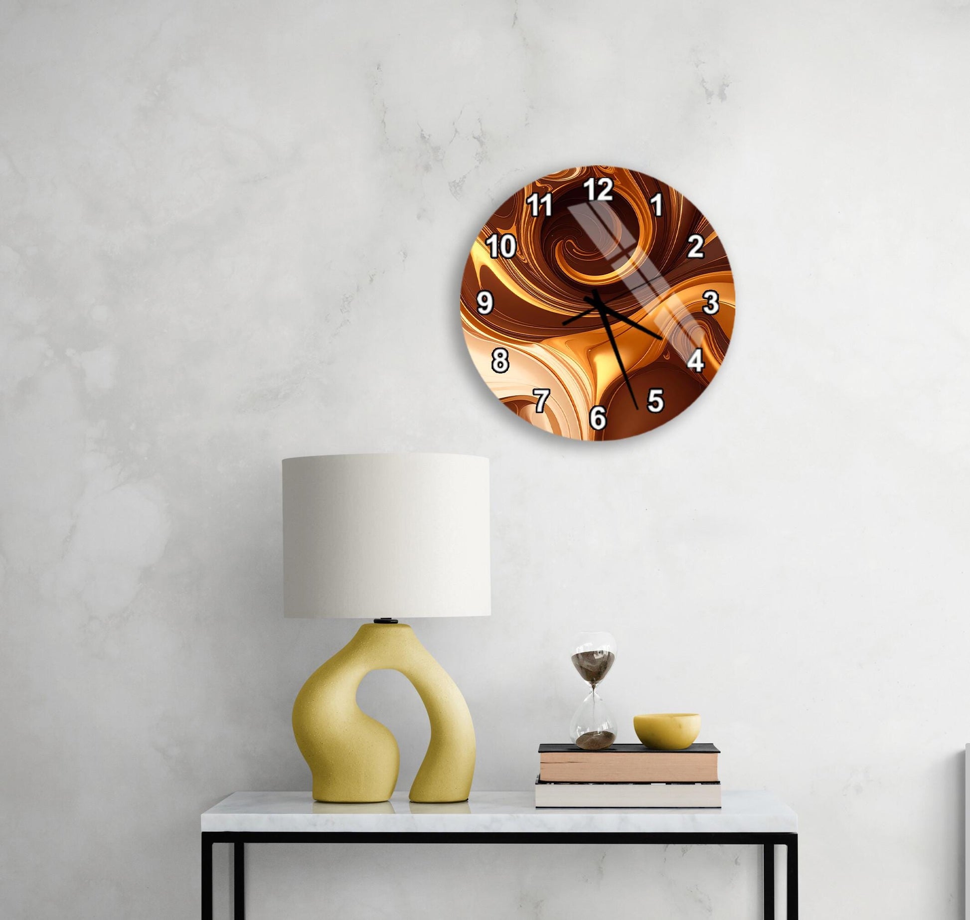 a modern wall clock with a unique design, a yellow lamp on a white table, and a stack of books and a glass of wine on the table.