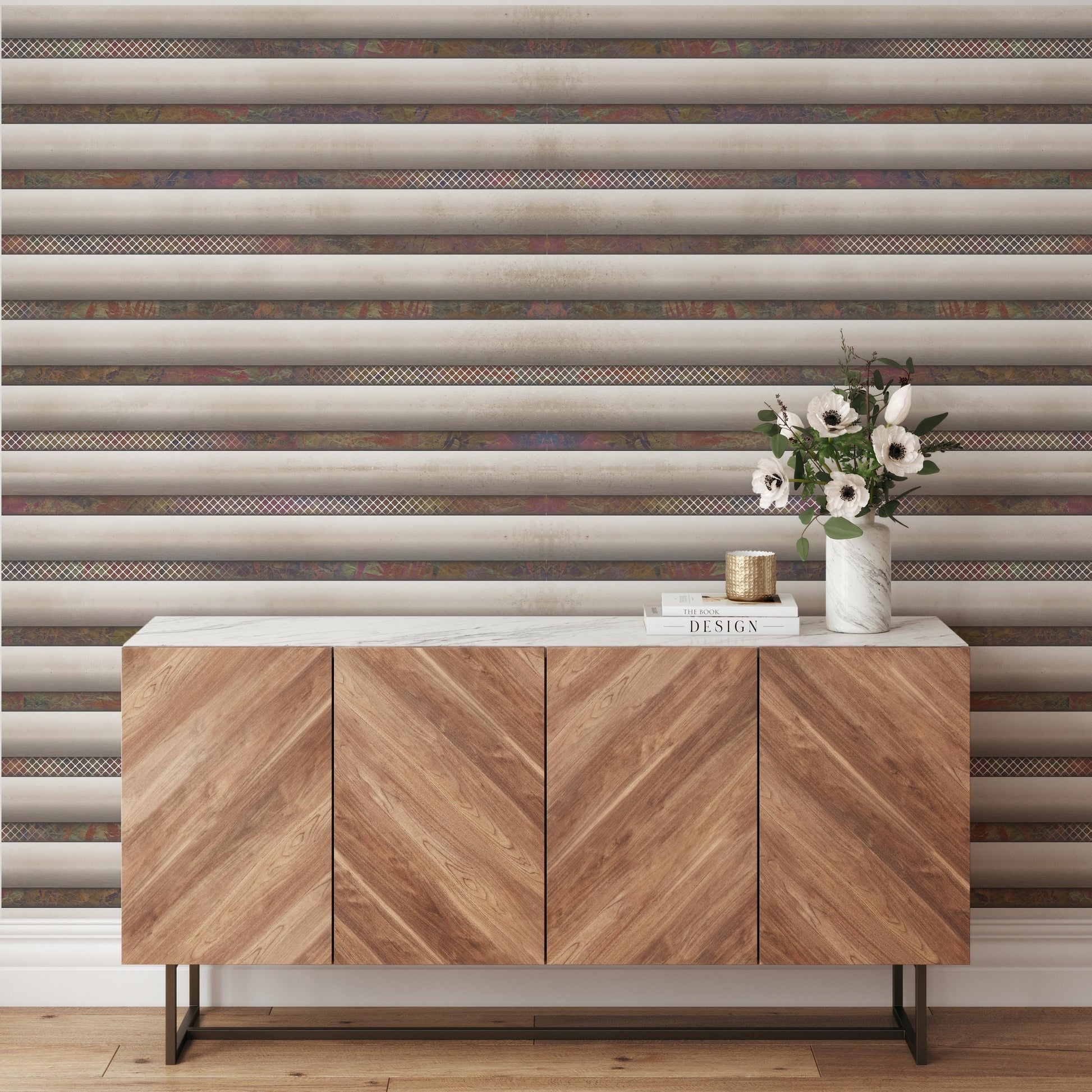 a wooden cabinet with a white marble top, set against a striped wall. The cabinet has three doors and a shelf, and there is a vase of flowers on top of it.