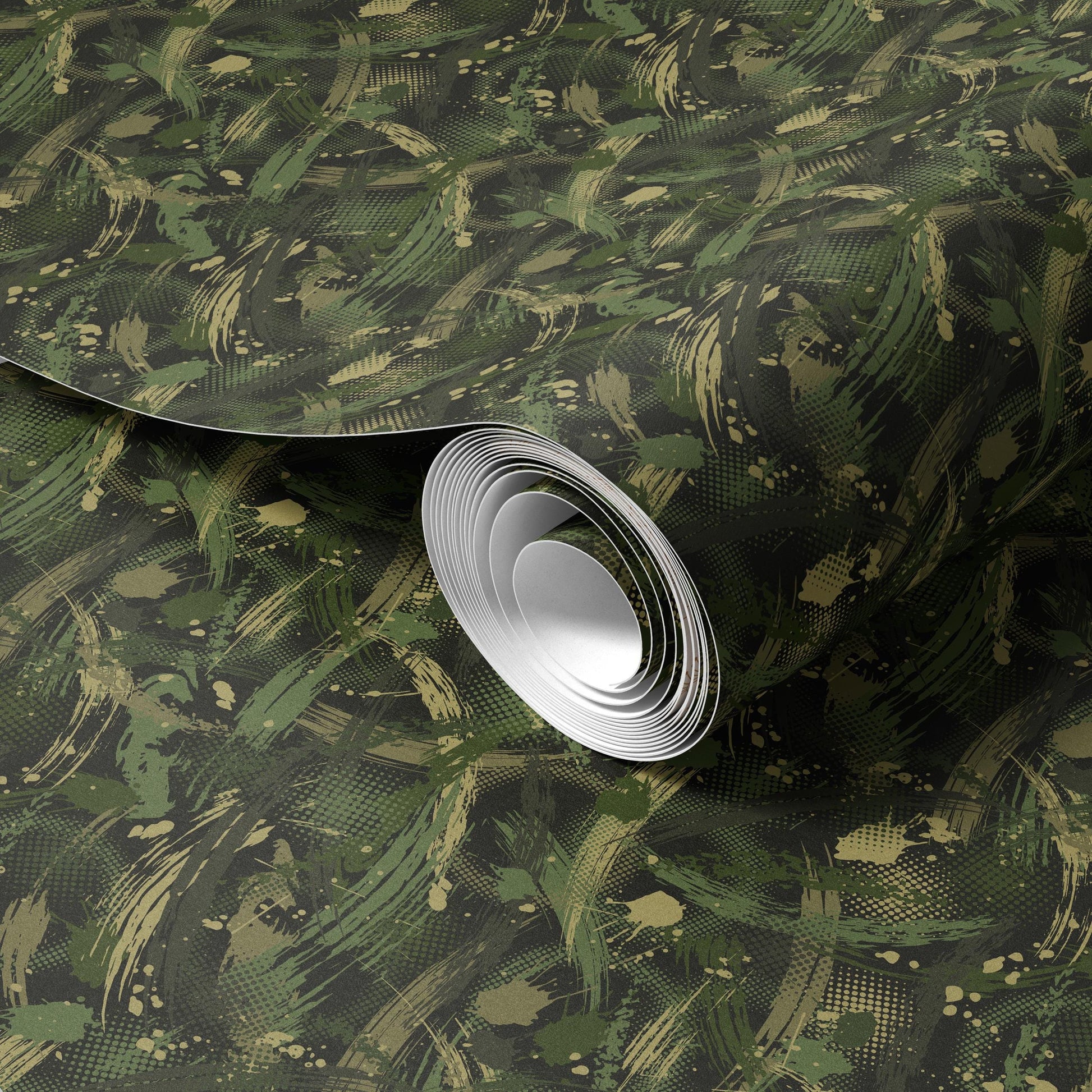 a roll of camouflage-patterned wallpaper or paper, with a white circular object placed on top of it.