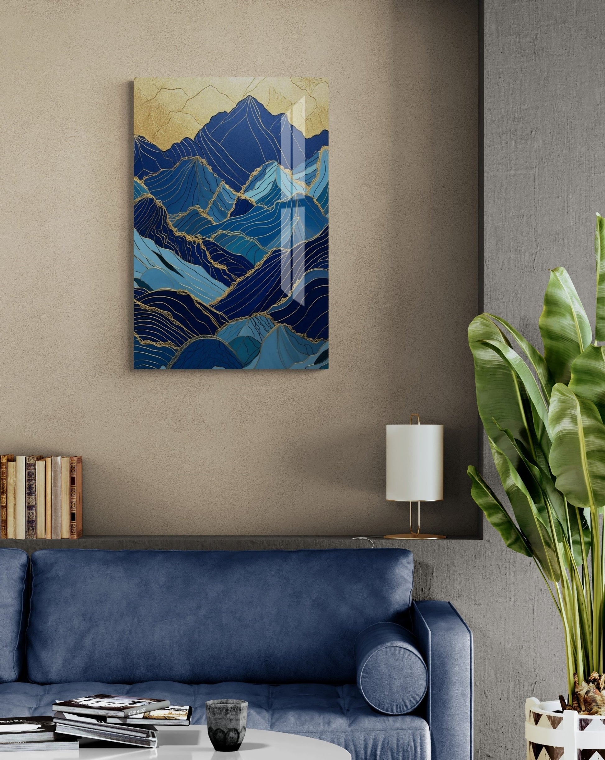 a living room with a blue couch and a painting on the wall