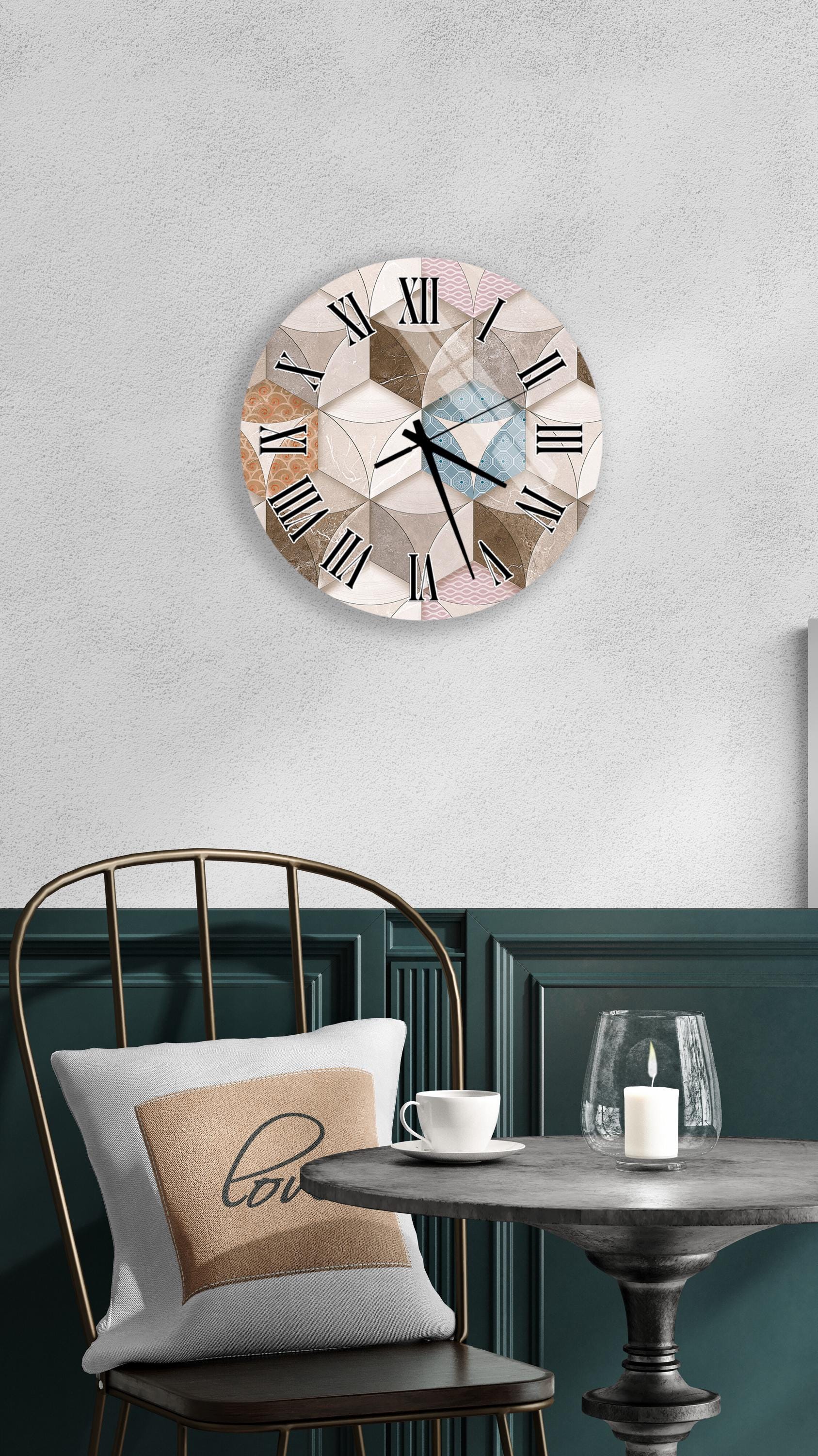 a modern and stylish interior design with a round wall clock, a black metal chair, a white table, and a beige pillow with the word "love" on it.