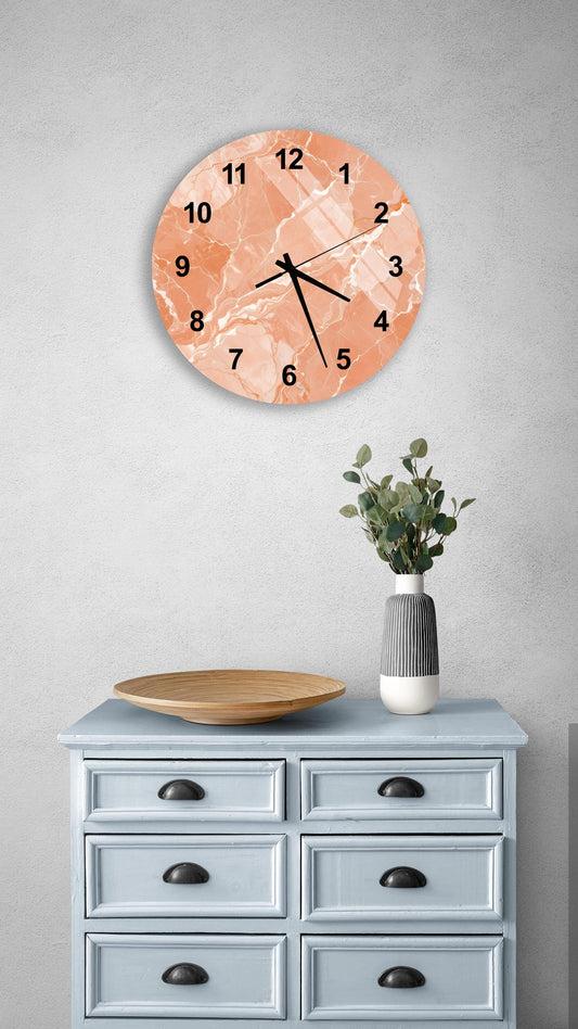 a light blue wooden dresser with a round clock hanging above it, a wooden plate on the dresser, and a vase with greenery on the dresser.