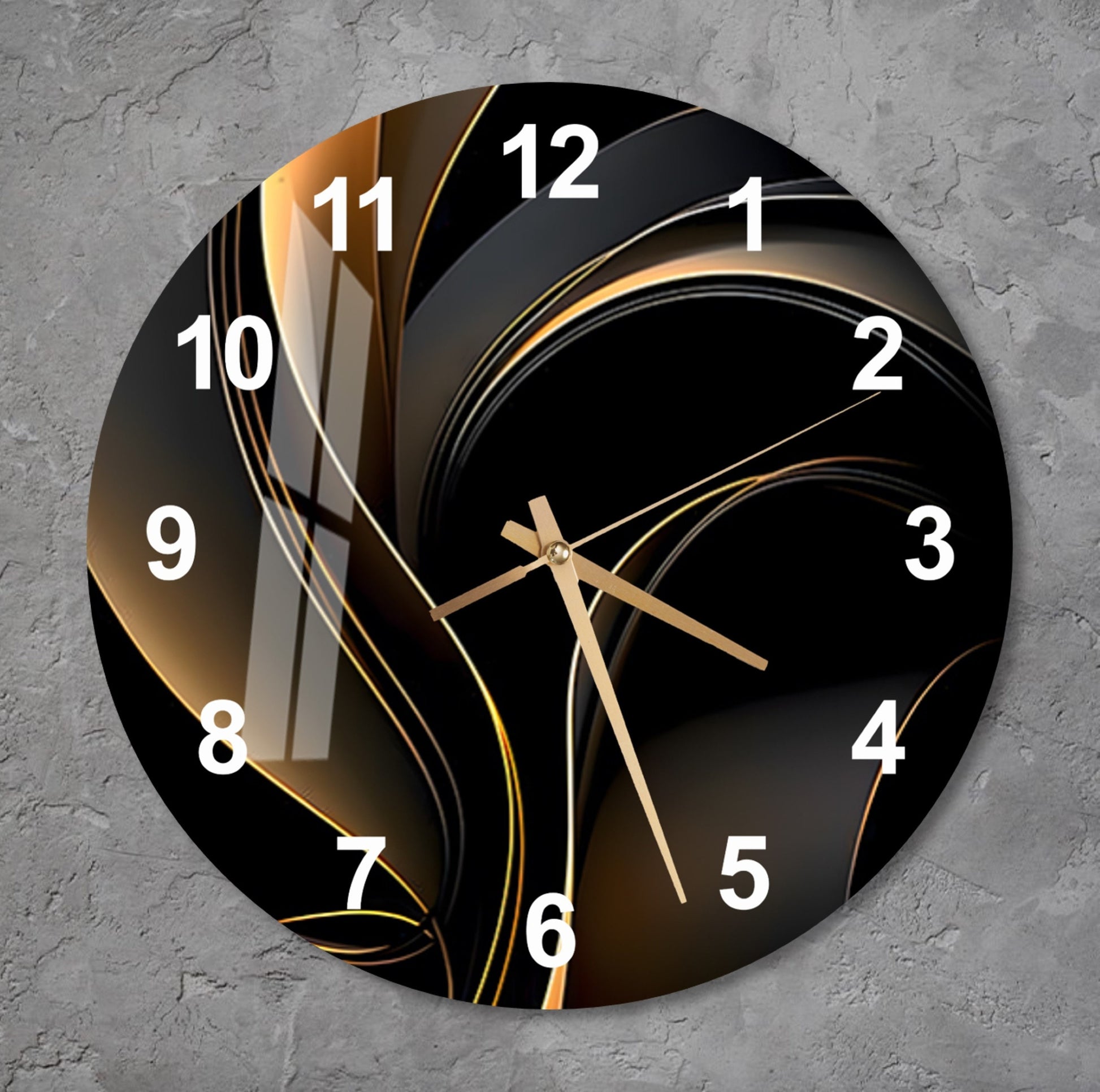 a black and gold clock on a gray wall