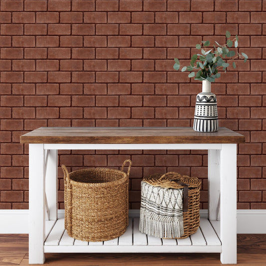a white wooden table with two woven baskets on it, placed against a brick wall.