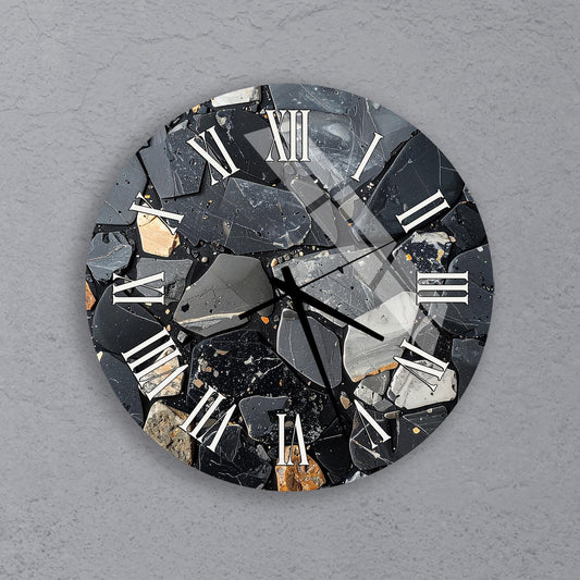 a clock with a unique design made of black and white rocks and minerals, creating a striking contrast against the gray background.