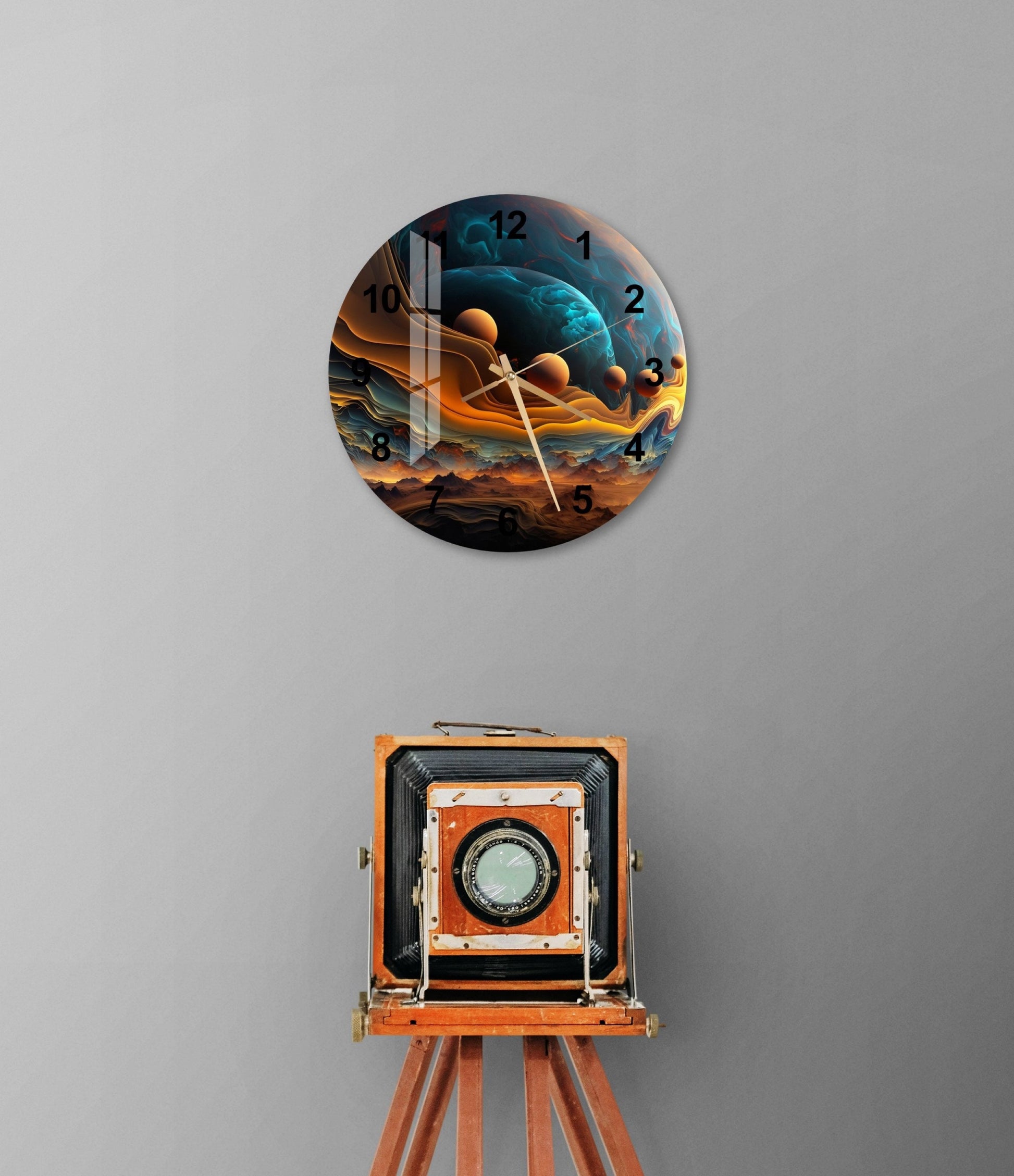 a clock that is on the wall above a tripod
