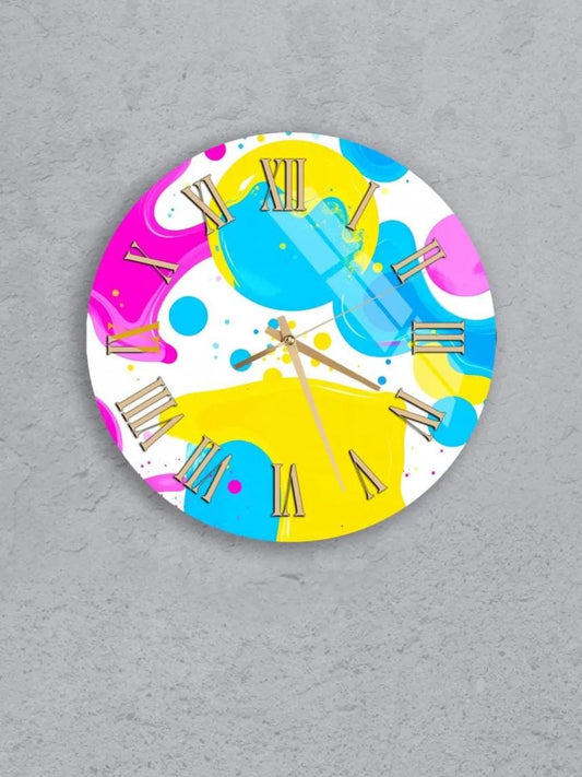 six colorful clocks with various designs and patterns, including polka dots, stripes, and abstract shapes, all set against a gray background.
