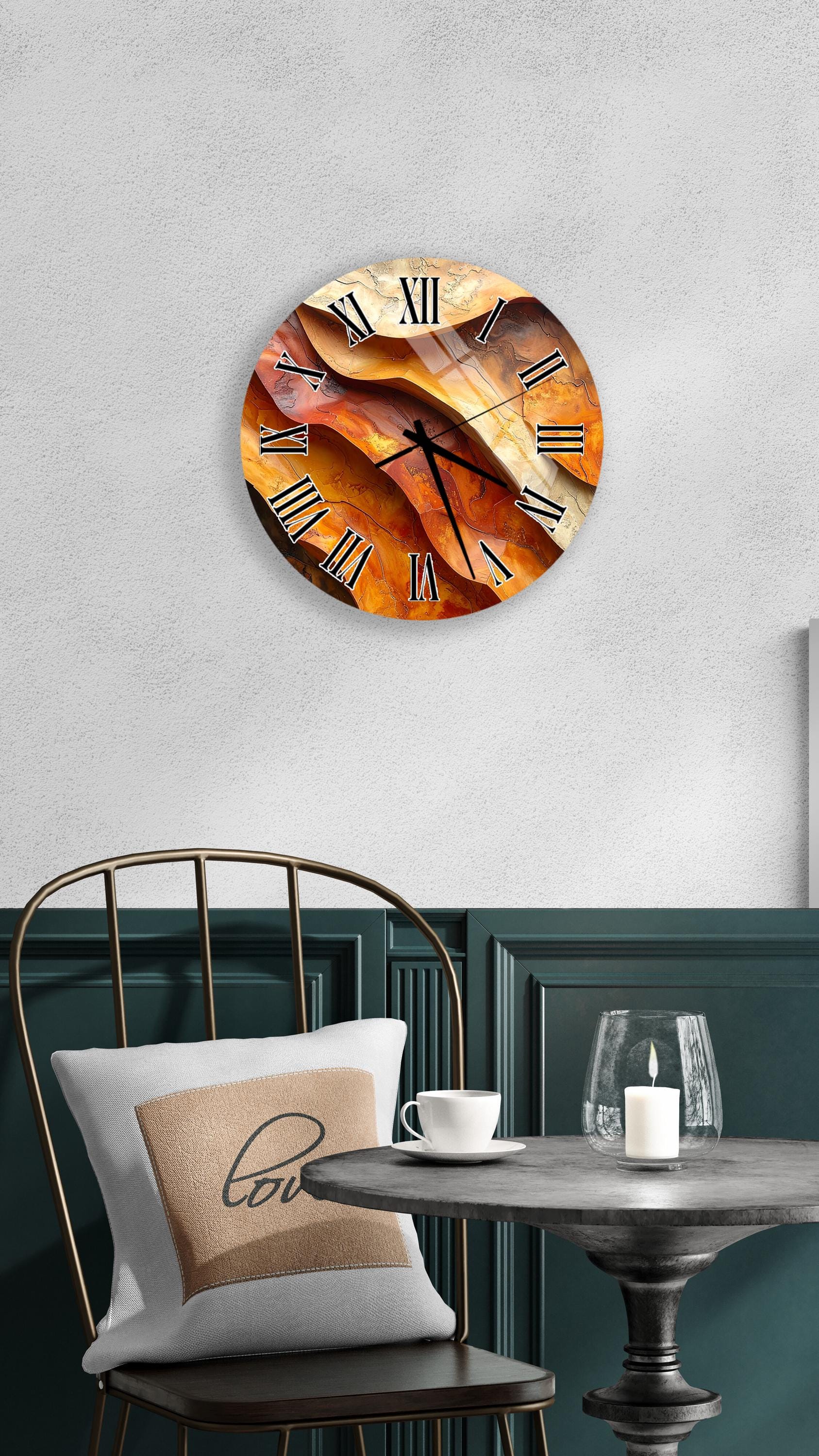 a round wall clock with an abstract design, mounted on a wall above a table with a white tablecloth.