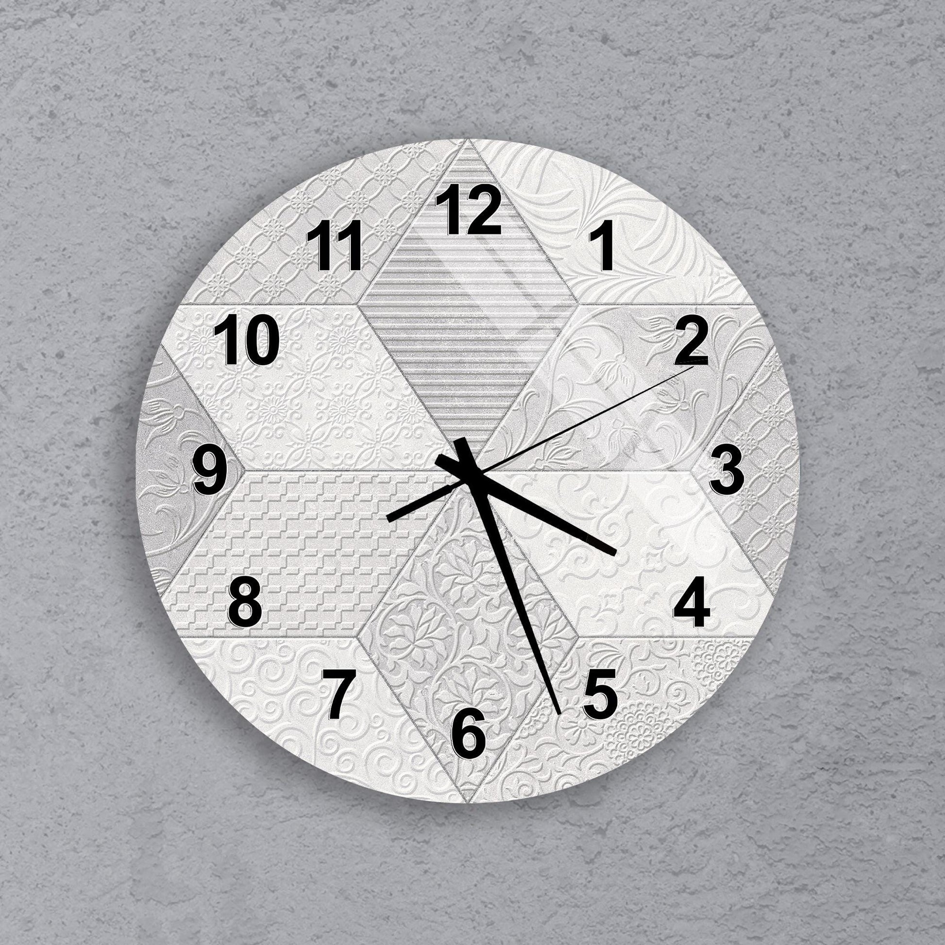 A wall clock with a unique design, featuring a combination of geometric shapes and patterns.