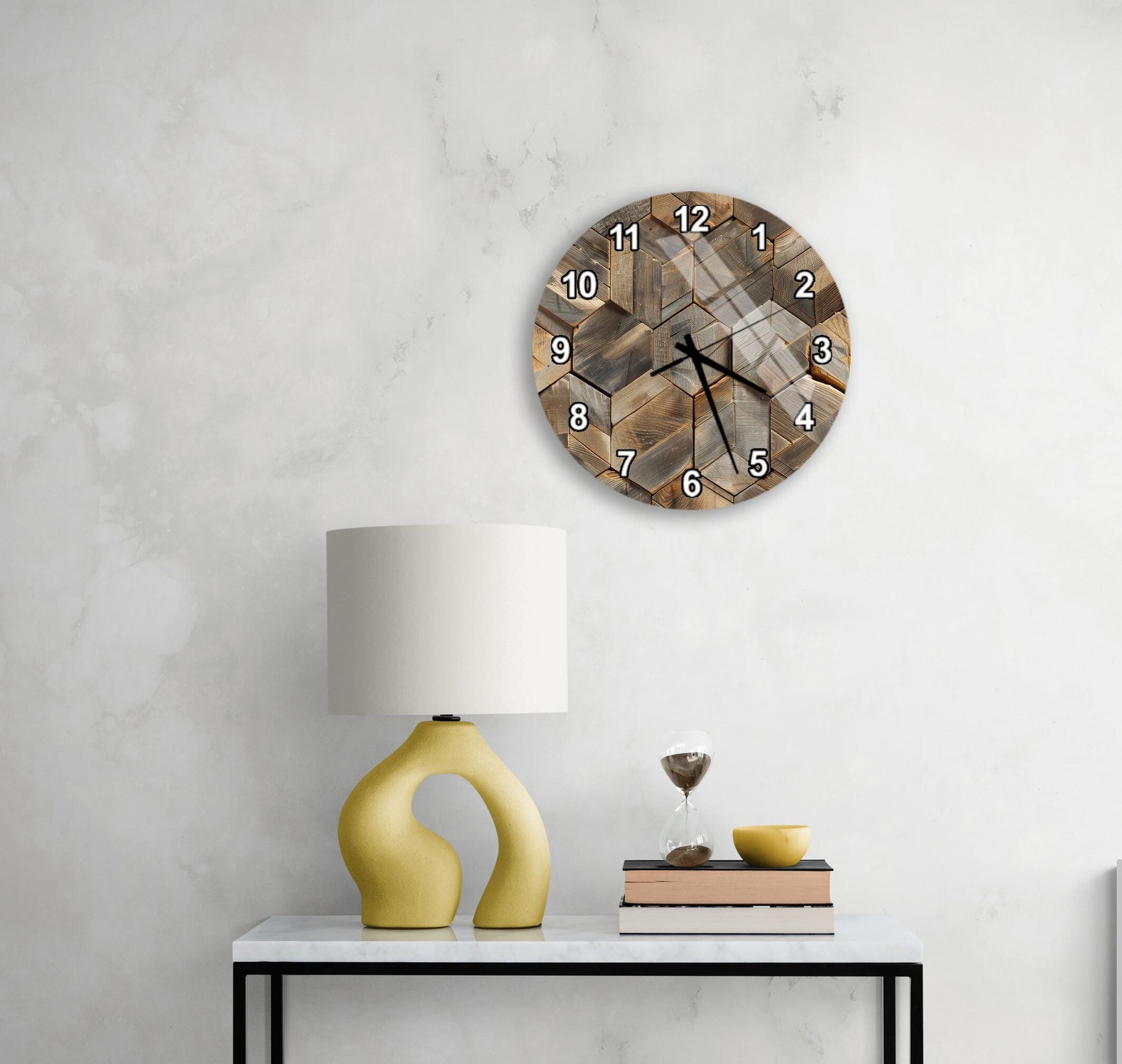 a modern living room with a white marble wall, a round wooden clock with a unique design, a yellow lamp with a curved base, a stack of books, and a glass of wine on a white table.