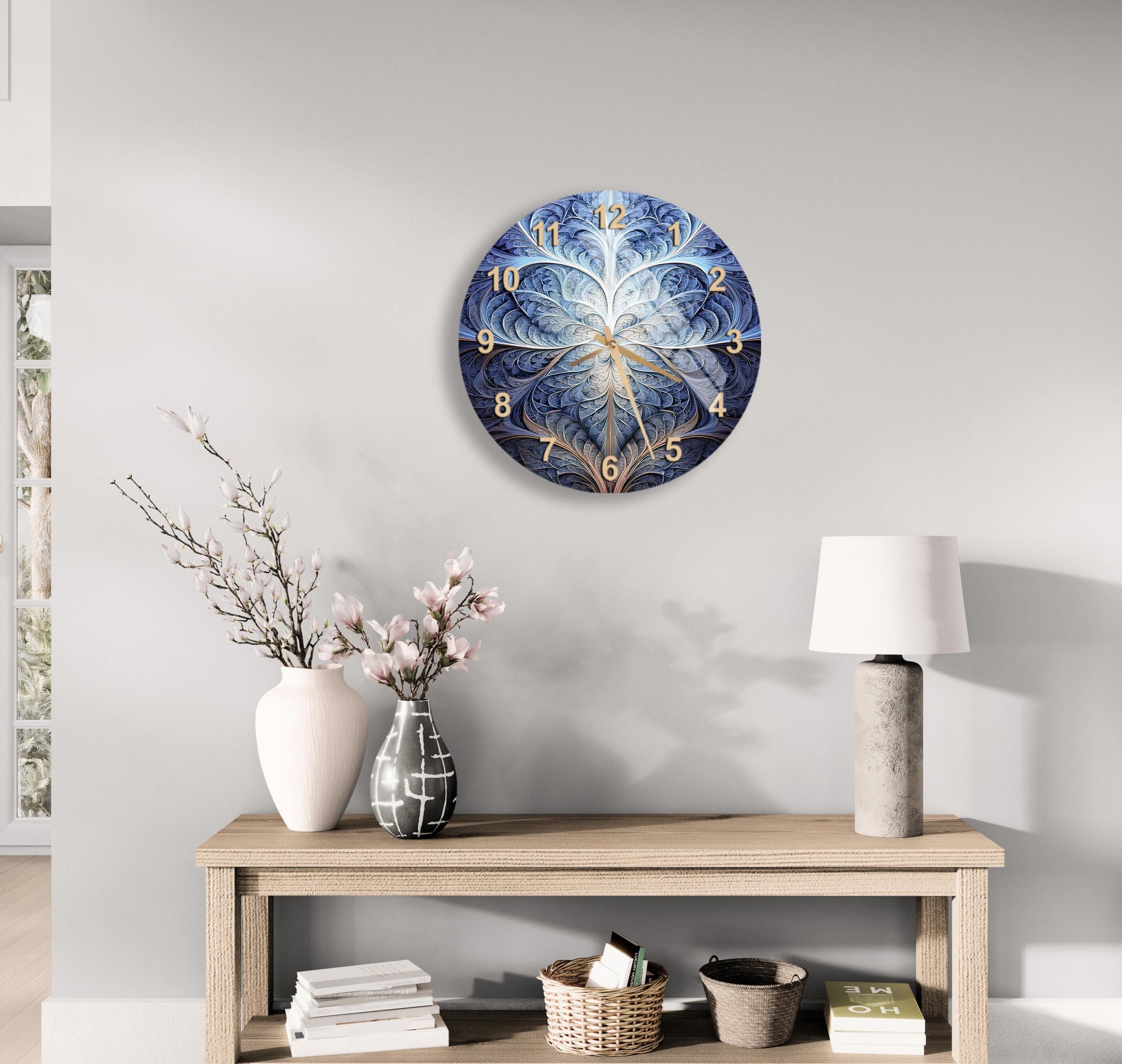 a clock on a wall above a table with a vase of flowers
