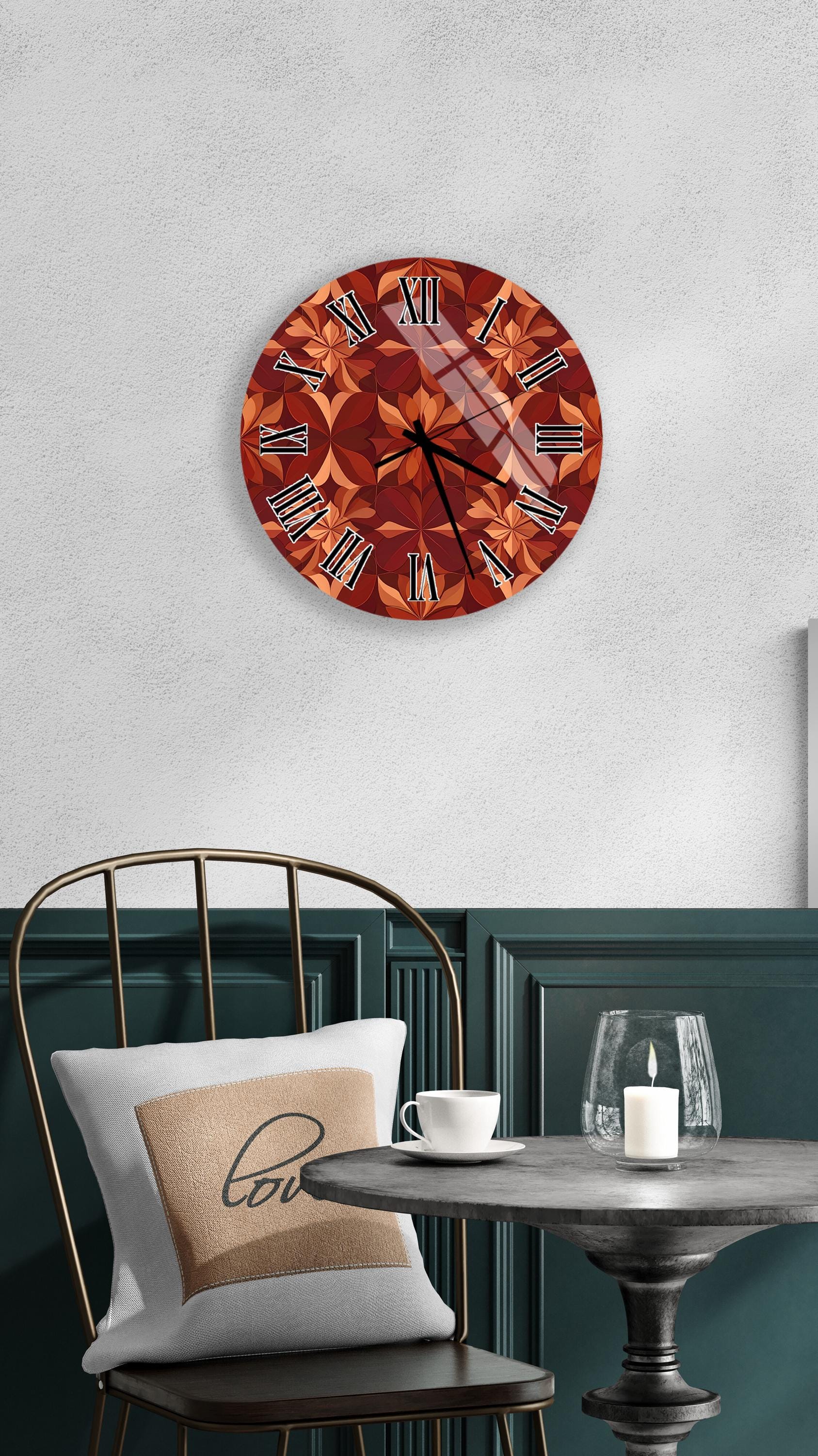 a wall clock with a floral design, a white table with a candle and a cup, and a chair with a pillow.