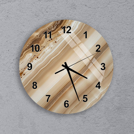 A wall clock with a marble-like design on its face, displaying the time as approximately 10:10.