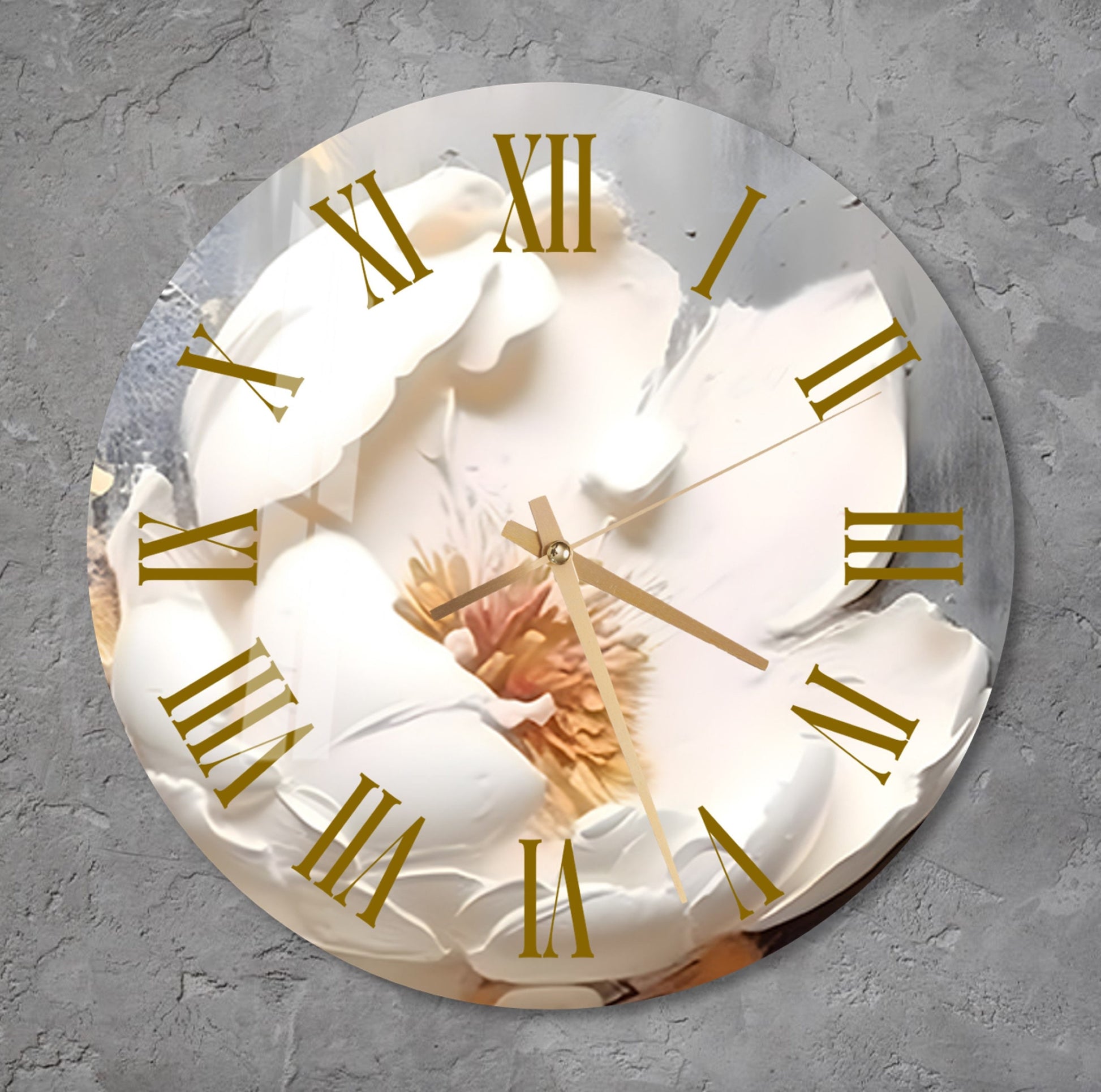 a white clock with gold numbers on a wall