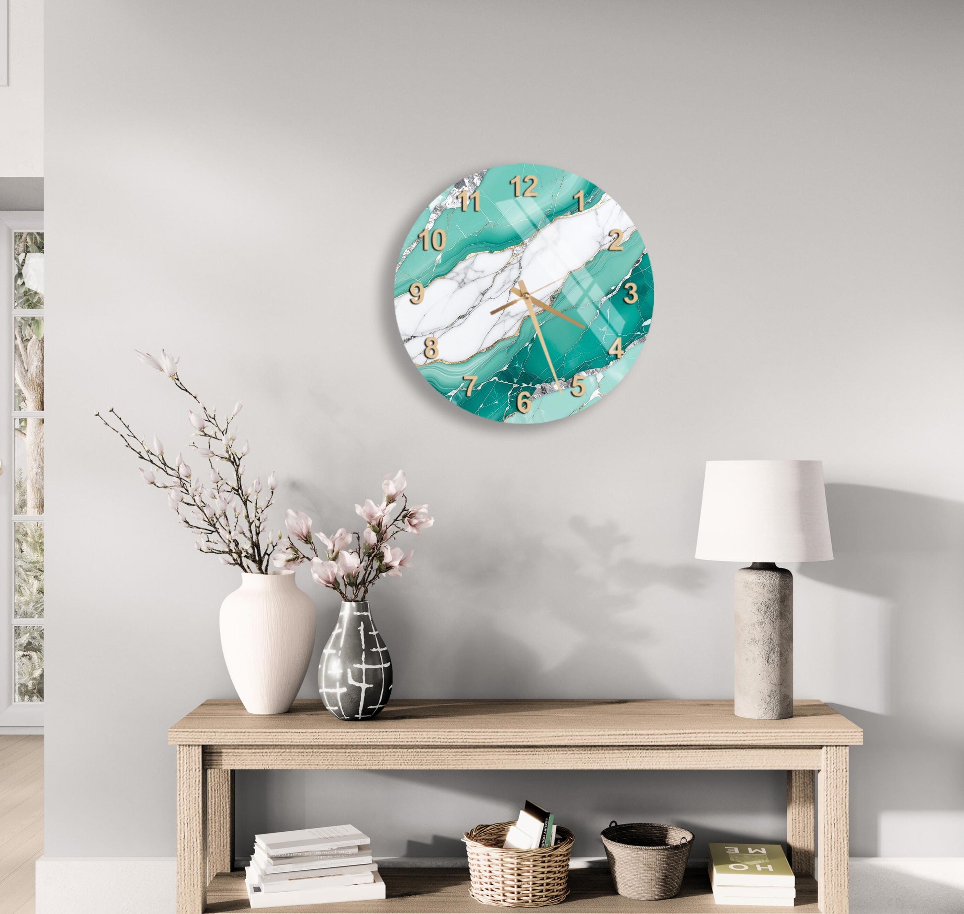 a modern living room with a wooden table, a lamp, a clock, and a vase with flowers. The clock has a marble and teal design, and the table has a white vase and a stack of books.