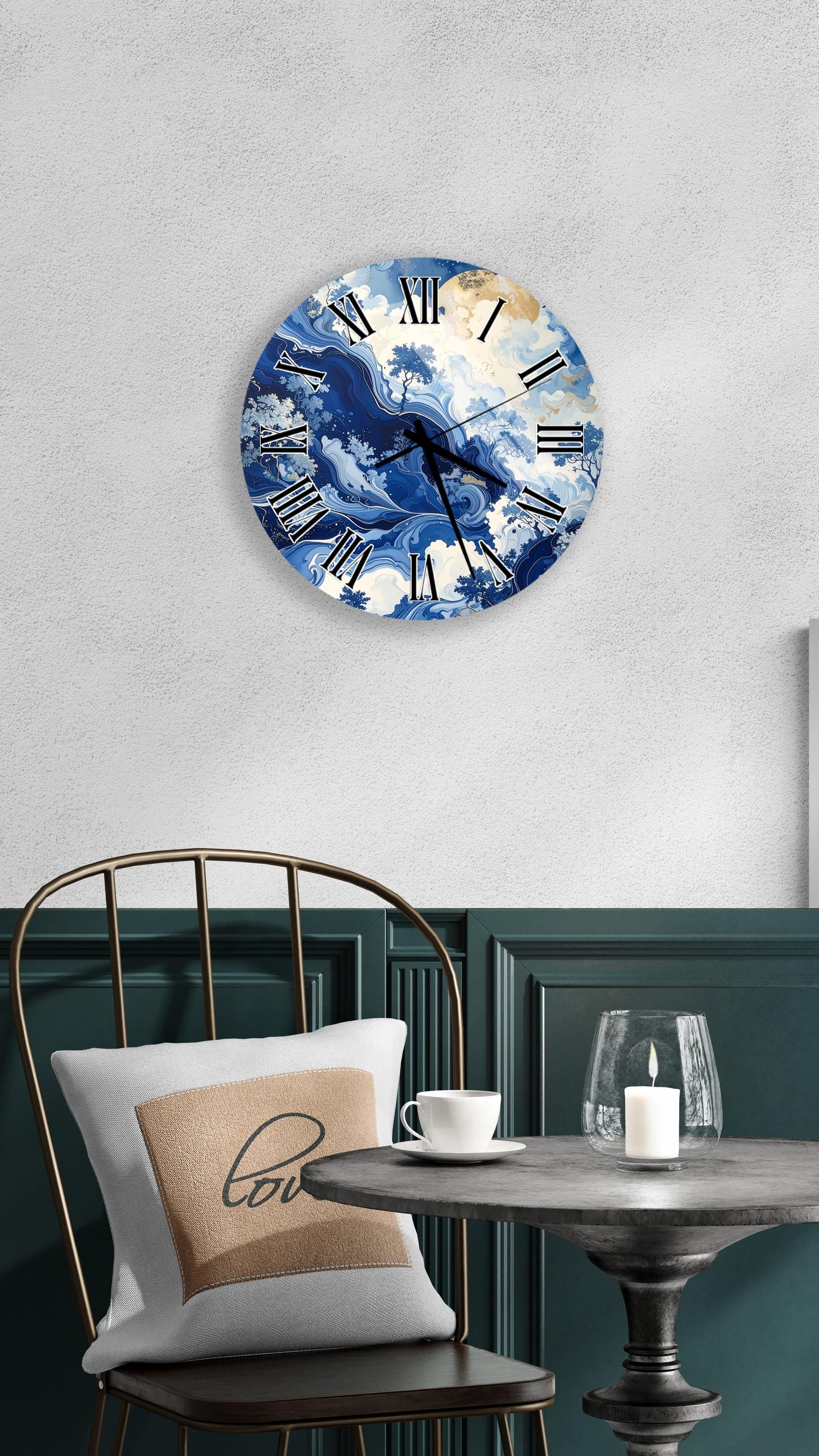 a round wall clock with a blue and white ocean wave design, mounted on a white wall above a table with a white tablecloth.