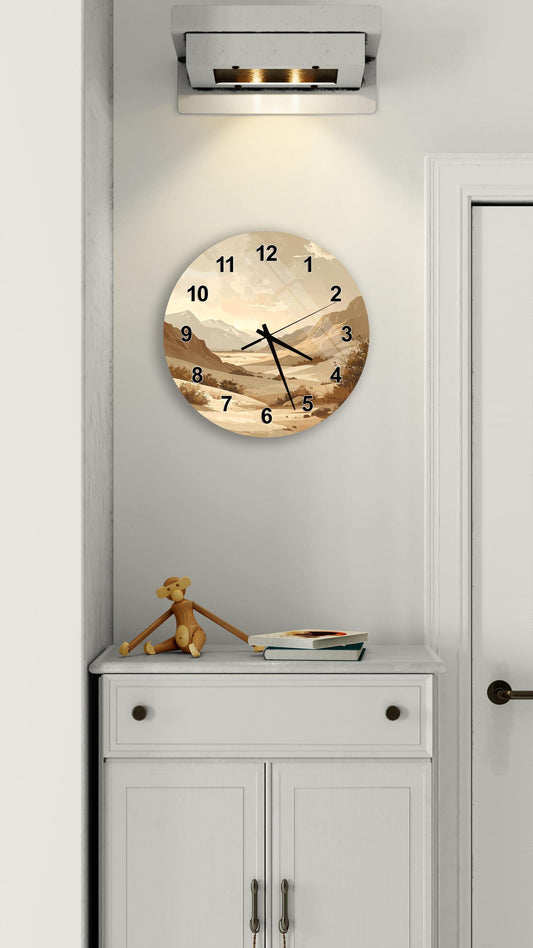 a wall clock with a landscape scene on its face, mounted on a white wall above a white cabinet.