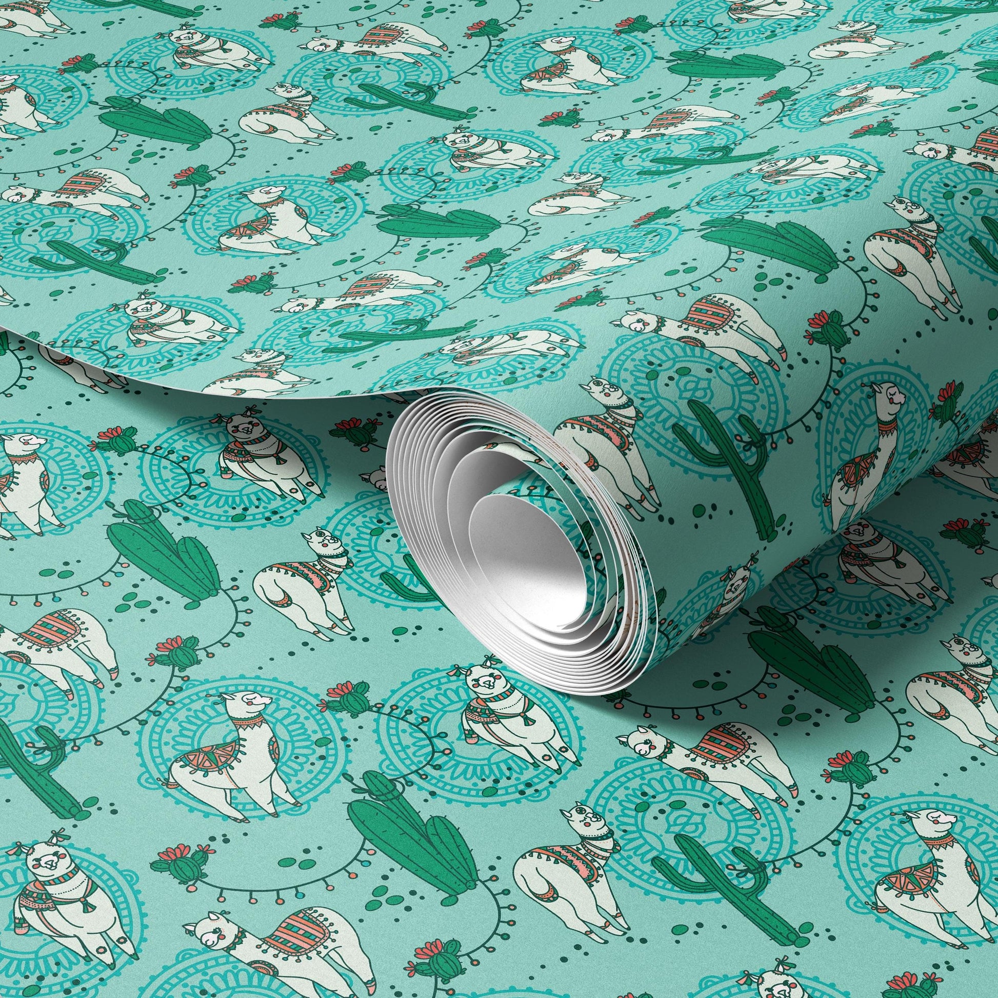 a roll of wrapping paper with a repeating pattern of white llamas and cacti on a turquoise background.