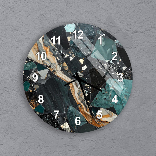 A wall clock with a unique, abstract design featuring a combination of black, green, and orange colors.