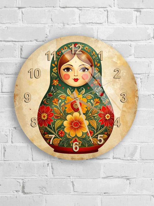 A round wall clock with a design featuring a doll with a floral pattern and a green background.