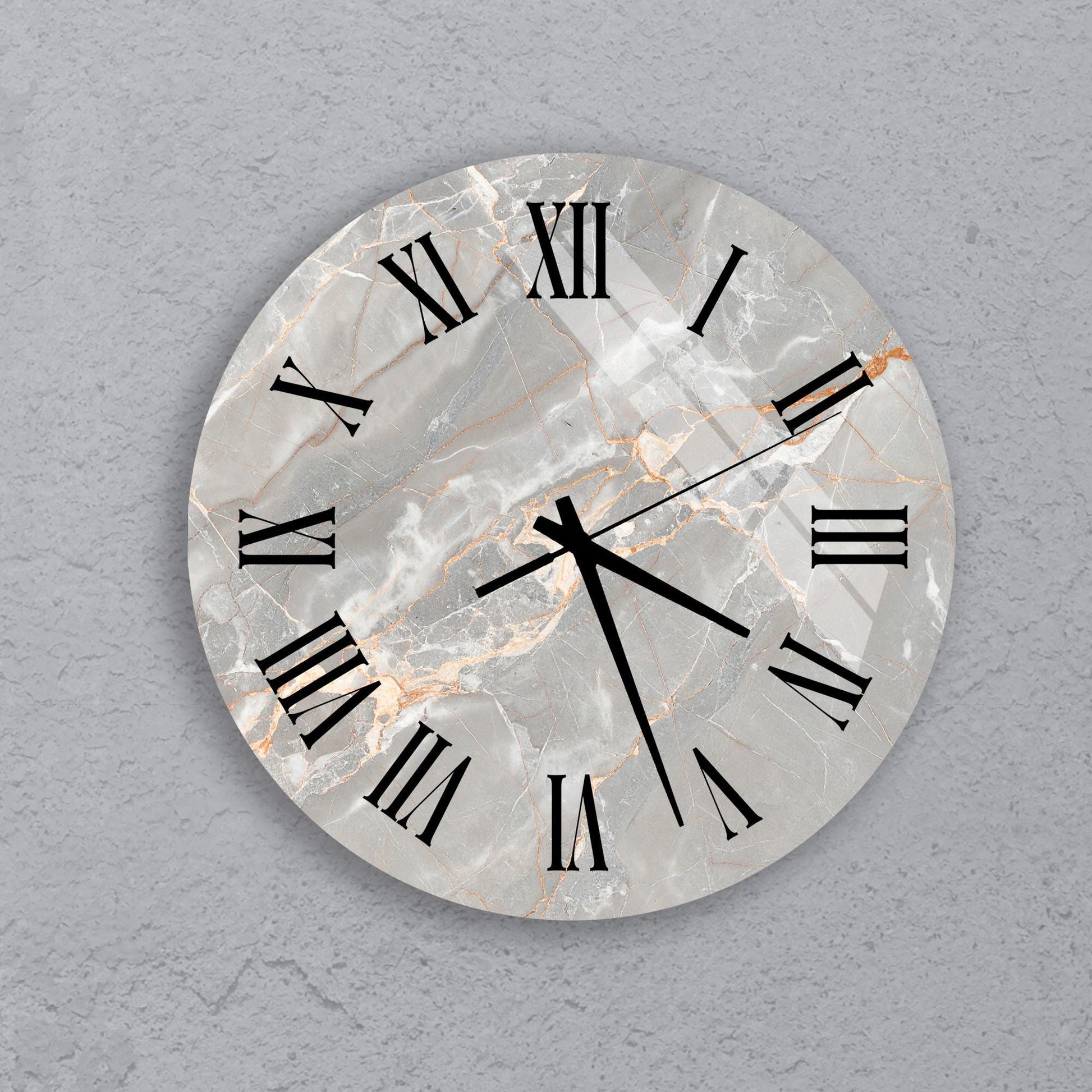 A round clock with Roman numerals on a marble background.