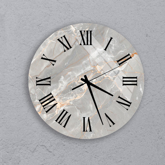 A round clock with Roman numerals on a marble background.