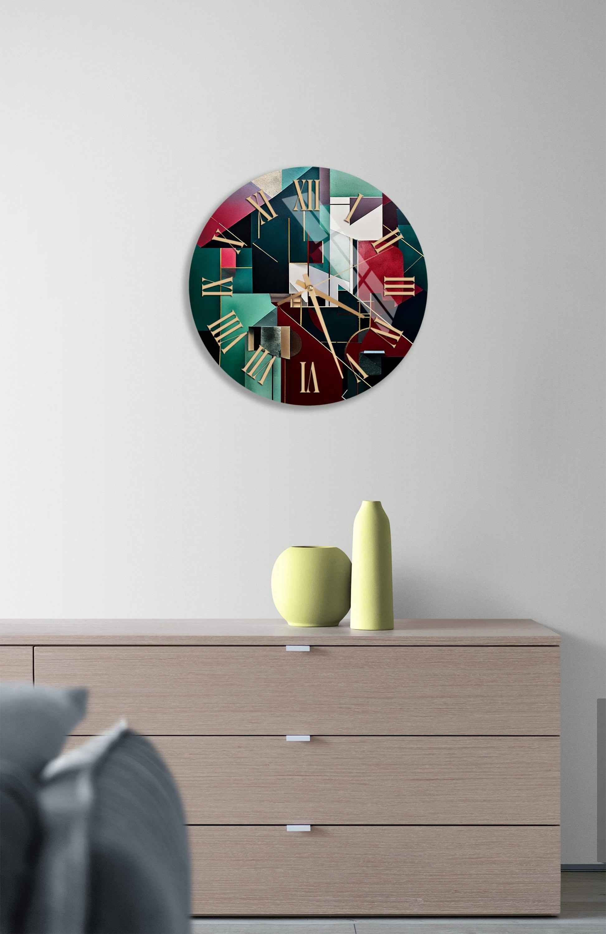 a clock on a wall above a dresser