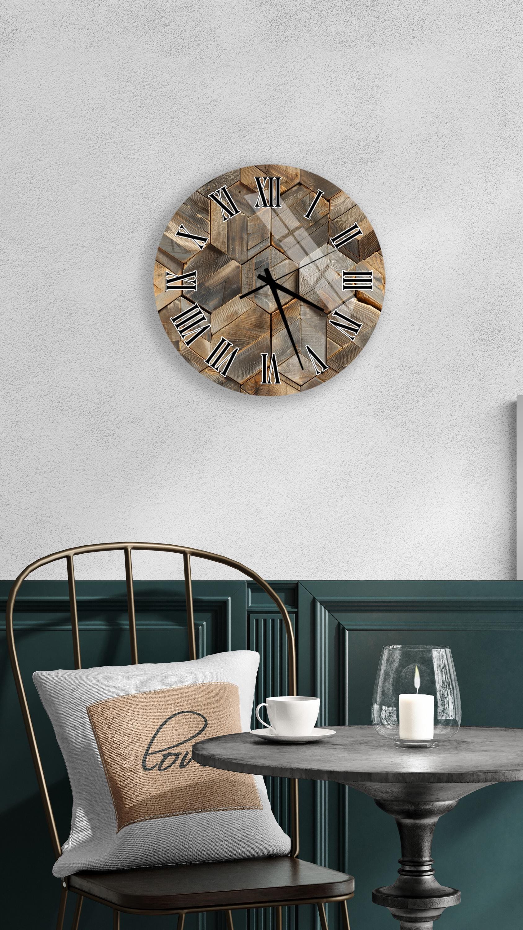 a modern interior design with a round wall clock, a black metal chair, a white table with a candle, and a beige pillow with the word "love" on it.