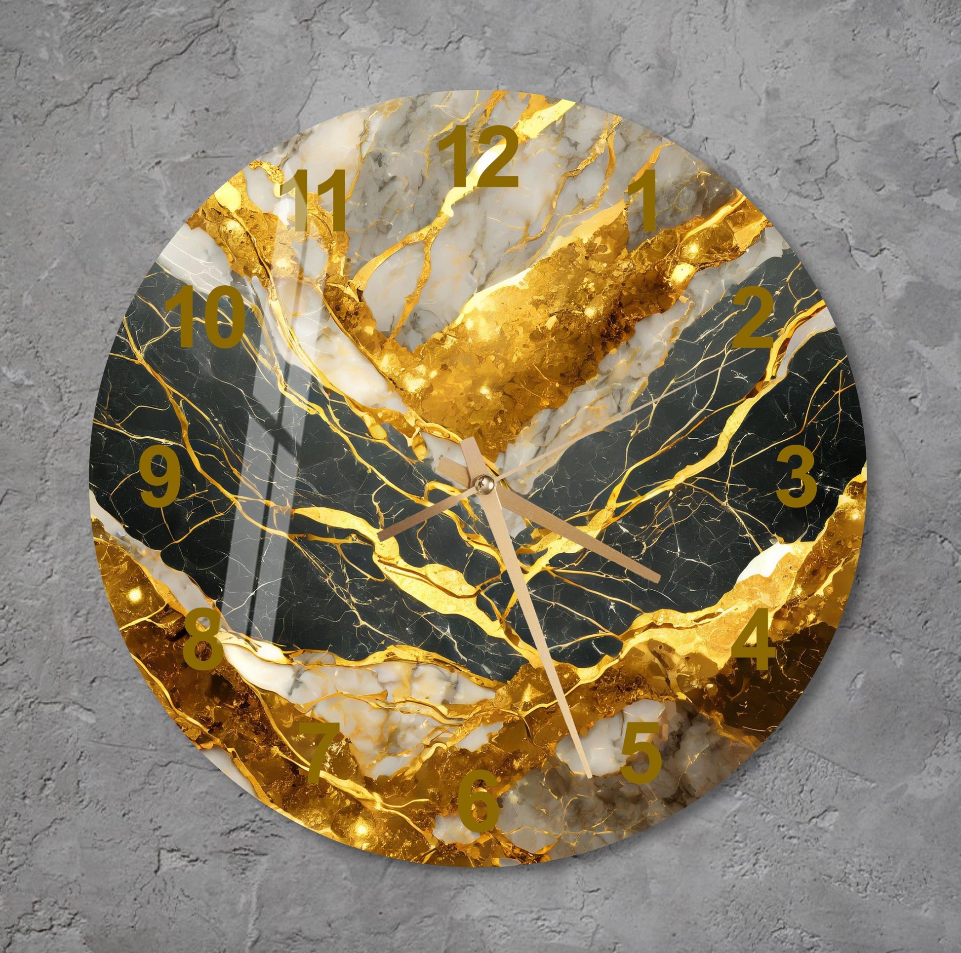 a clock with a gold leaf design on it