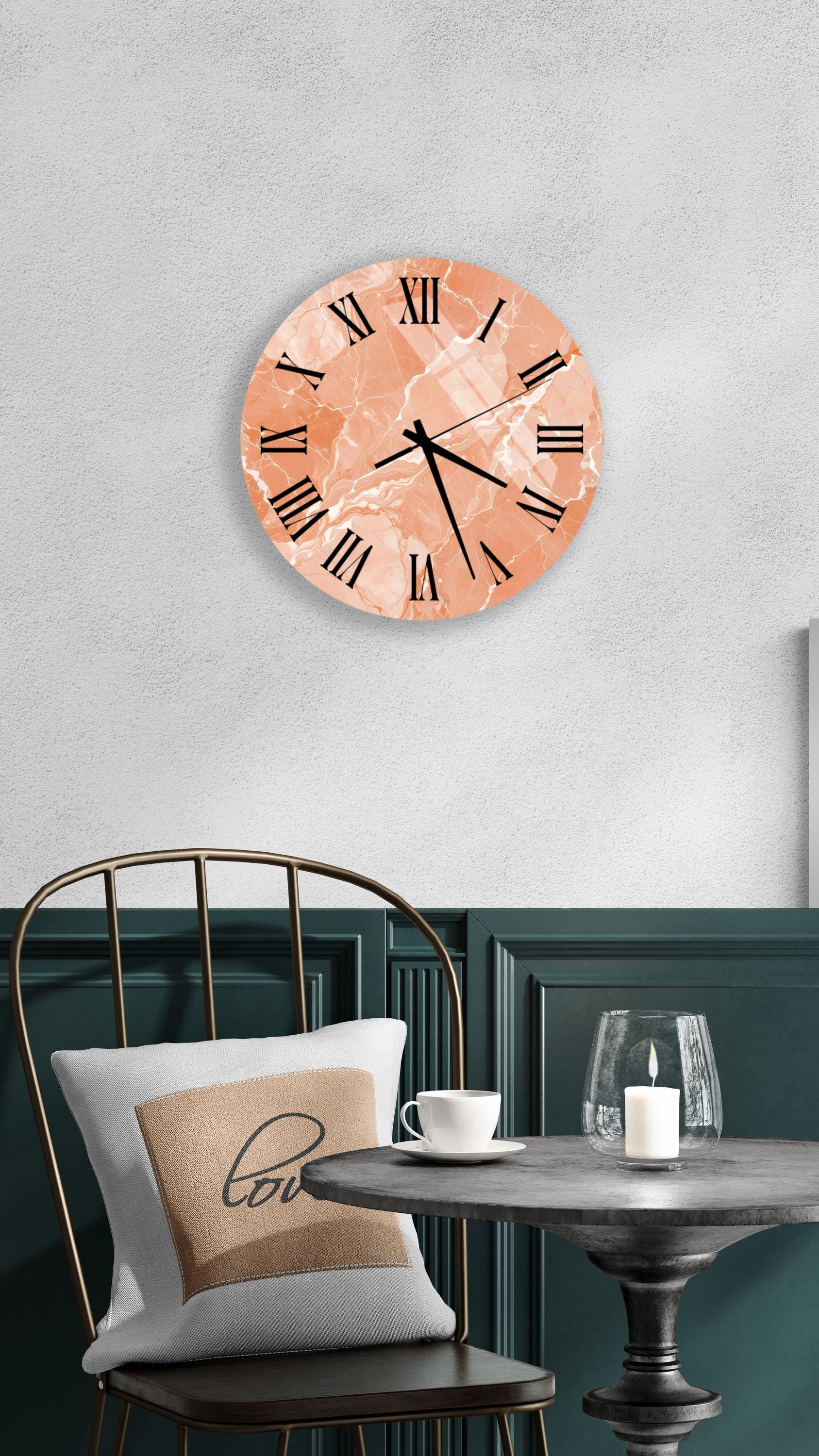 a modern and stylish interior design with a round wall clock, a black metal chair, a white table, and a beige pillow with the word "love" on it.