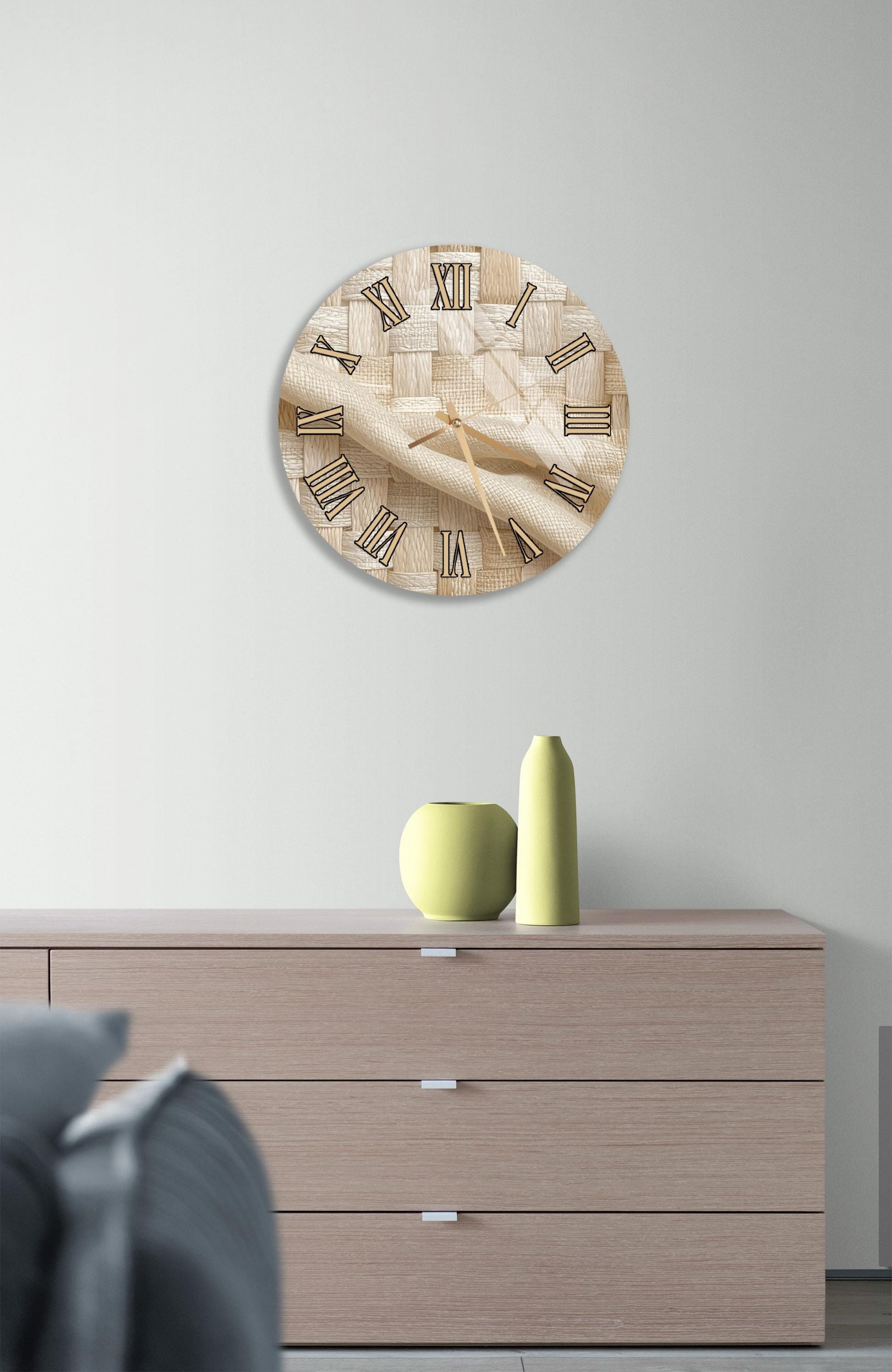 a wooden dresser with a round clock on the wall above it, and a small green vase on the dresser.