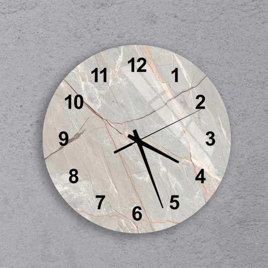 A round wall clock with a marble-like texture and black numbers on a gray background.